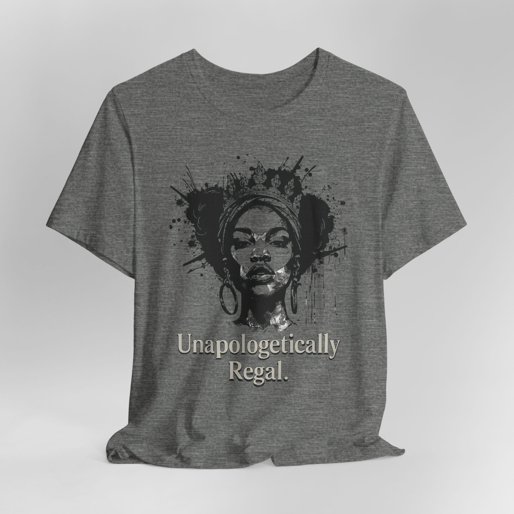 Gray t-shirt with a graphic of a woman's face and the text 'Unapologetically Regal' on a white background