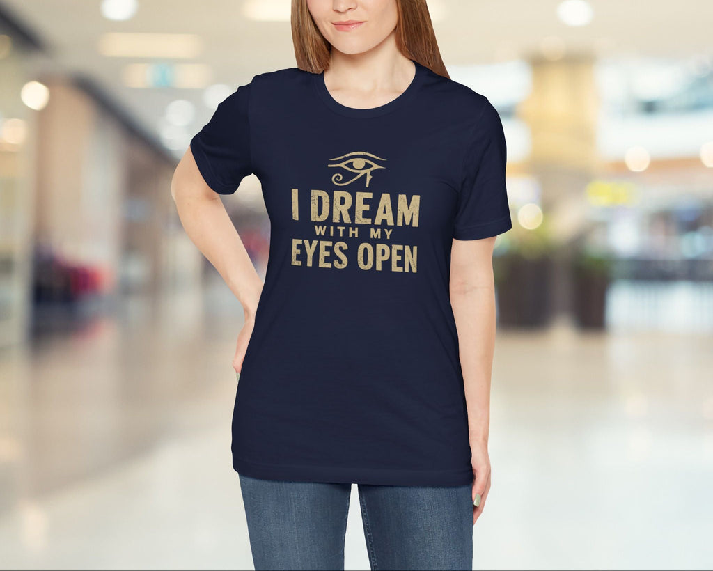 Woman wearing a navy blue t-shirt with a quote in a mall setting