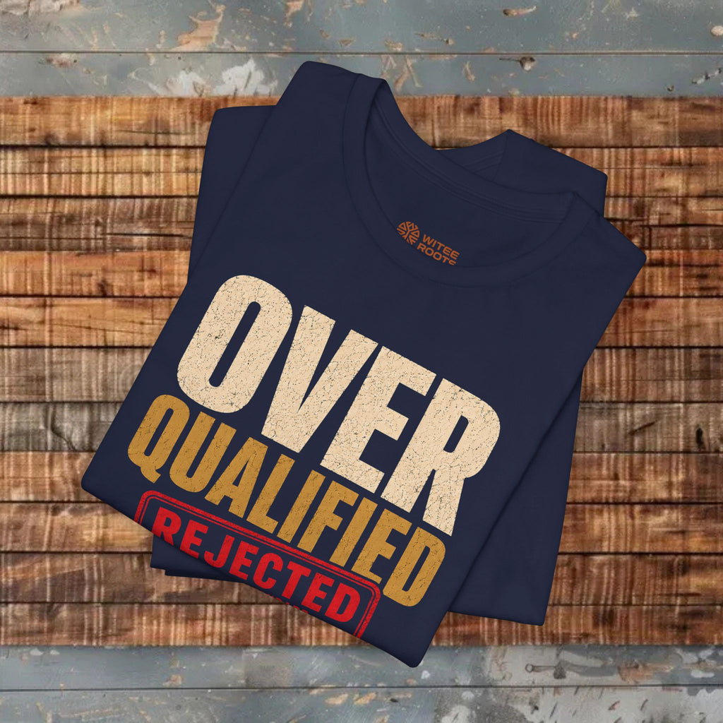 Folded navy blue t-shirt with text on a wooden surface