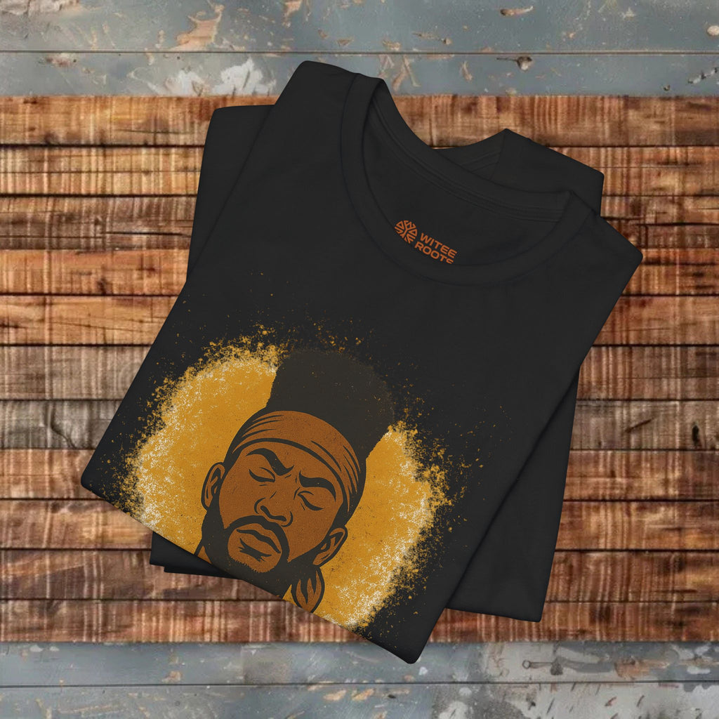Black t-shirt with a graphic design of a face on a wooden surface