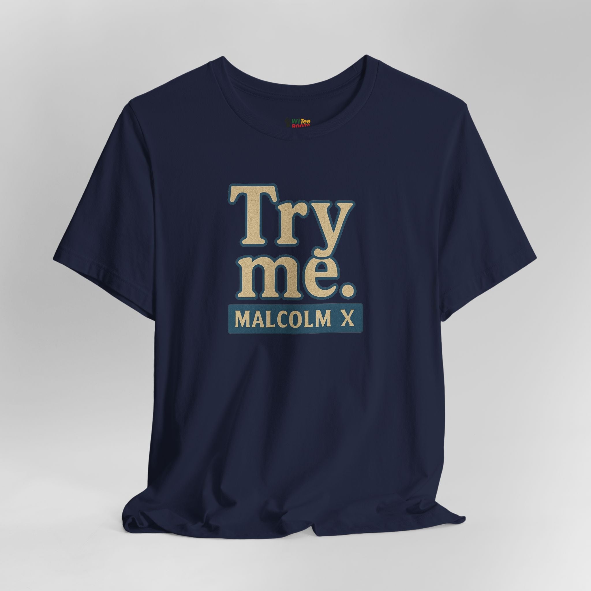 Navy blue t-shirt with 'Try me. MALCOLM X' text on a gray background