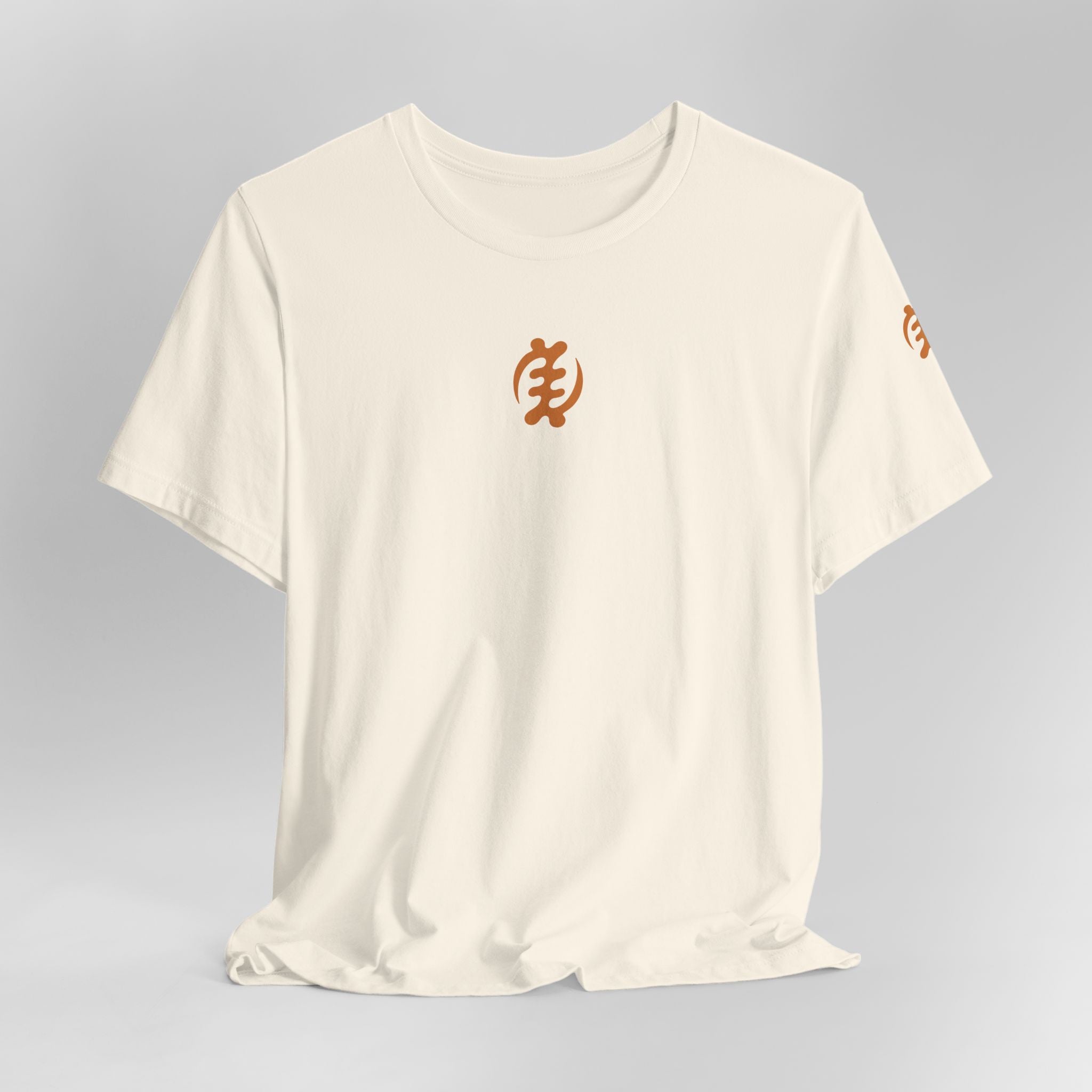 Beige t-shirt with orange text on a gray background