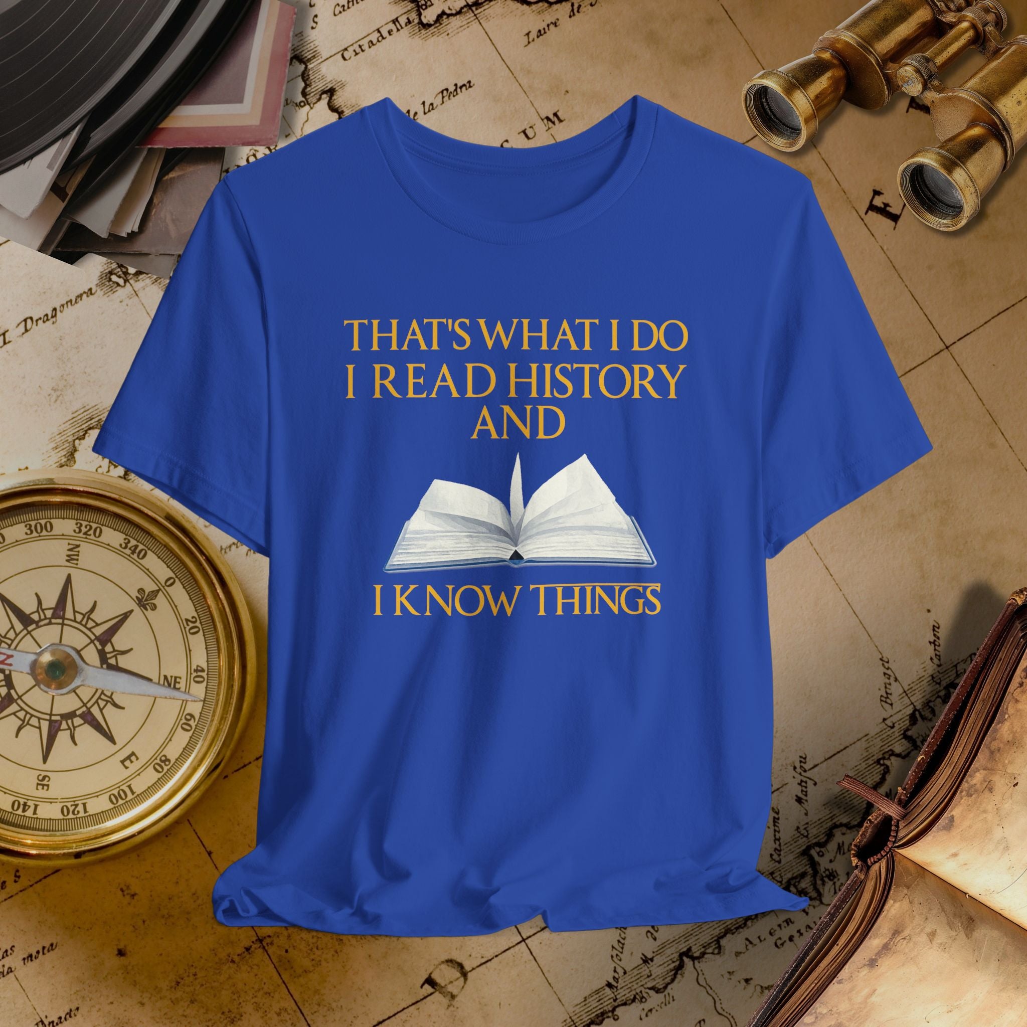 Blue t-shirt with text and book graphic on a historical-themed background