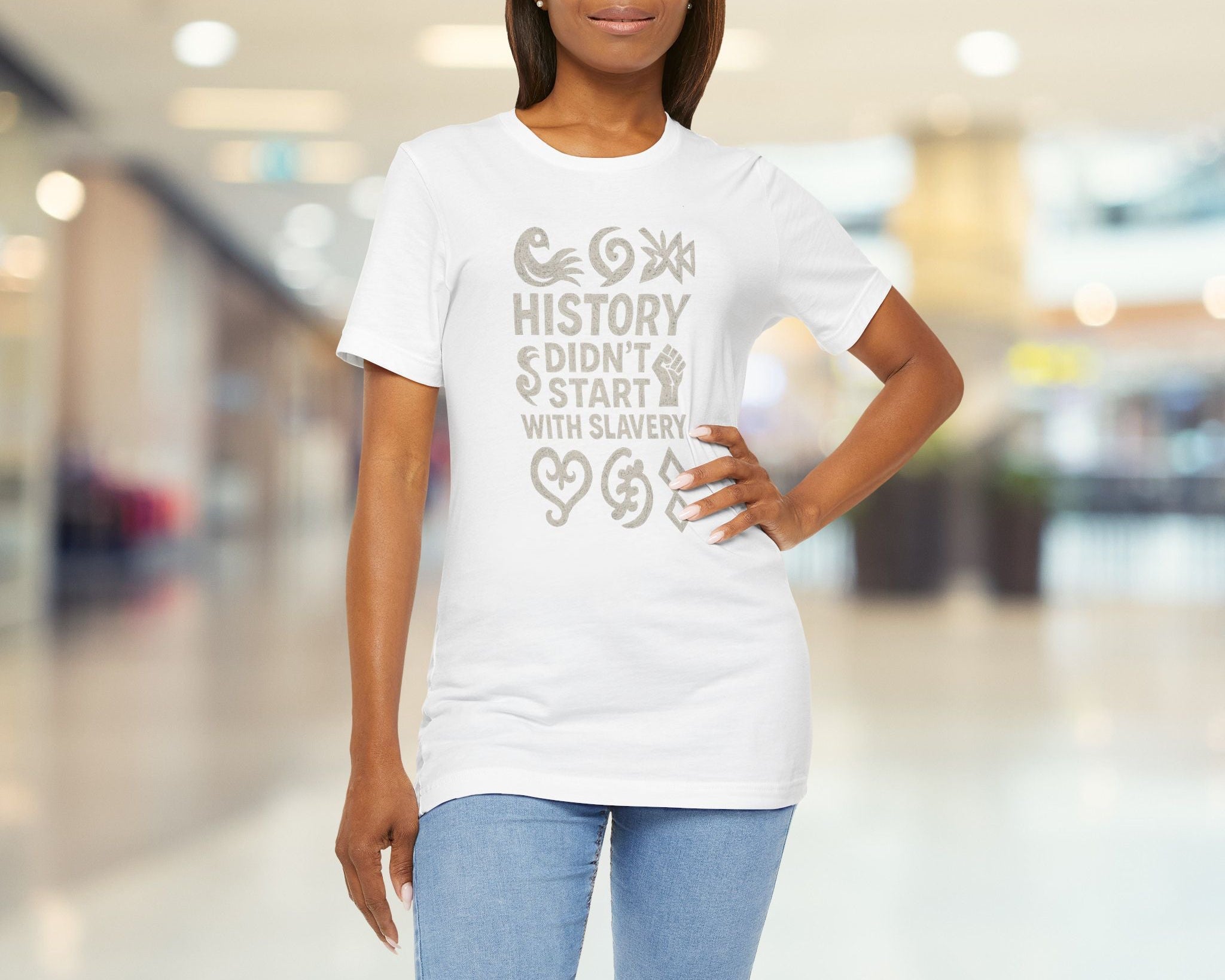 Woman wearing a white t-shirt with a message in a mall setting