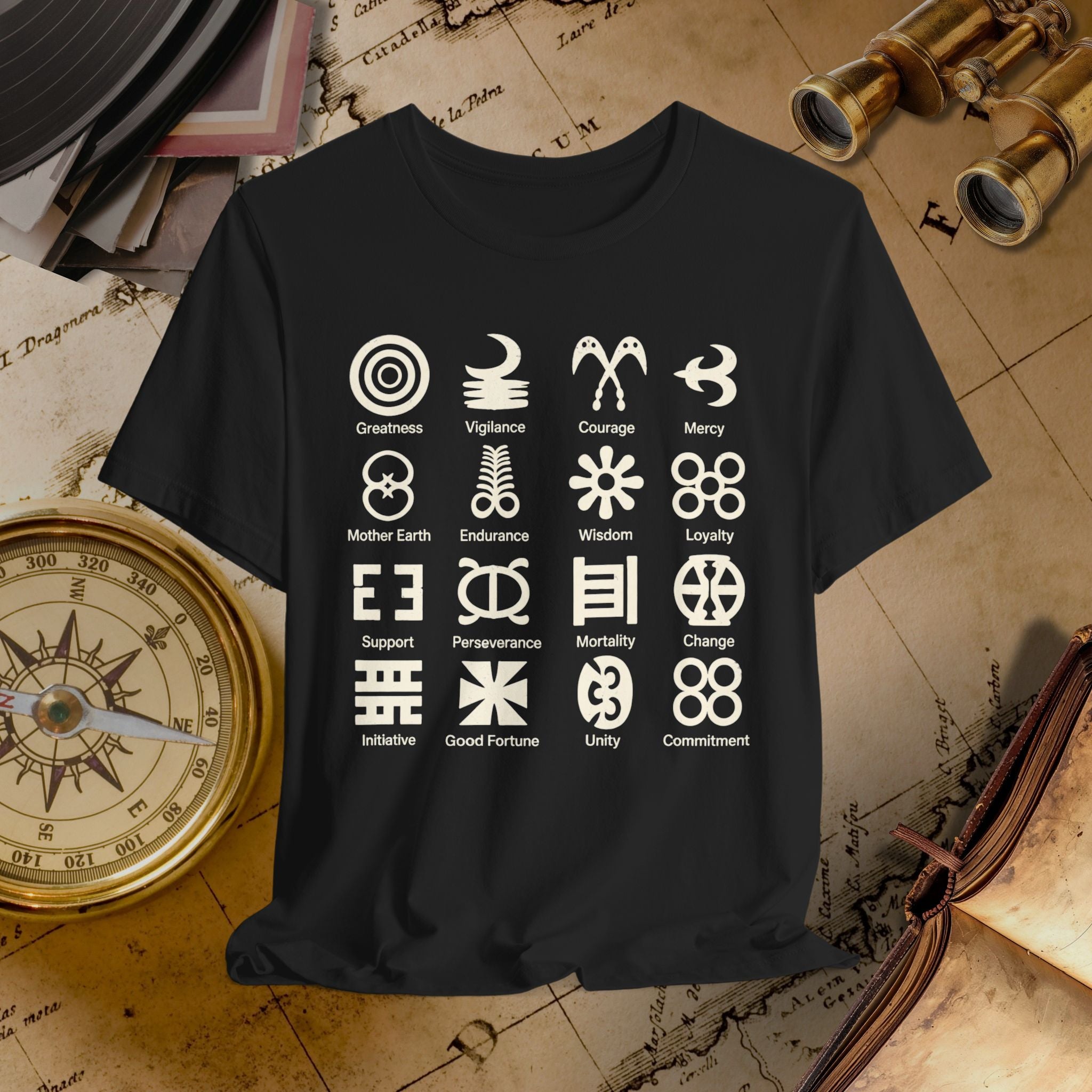 Black t-shirt with white symbols and text on a vintage map background