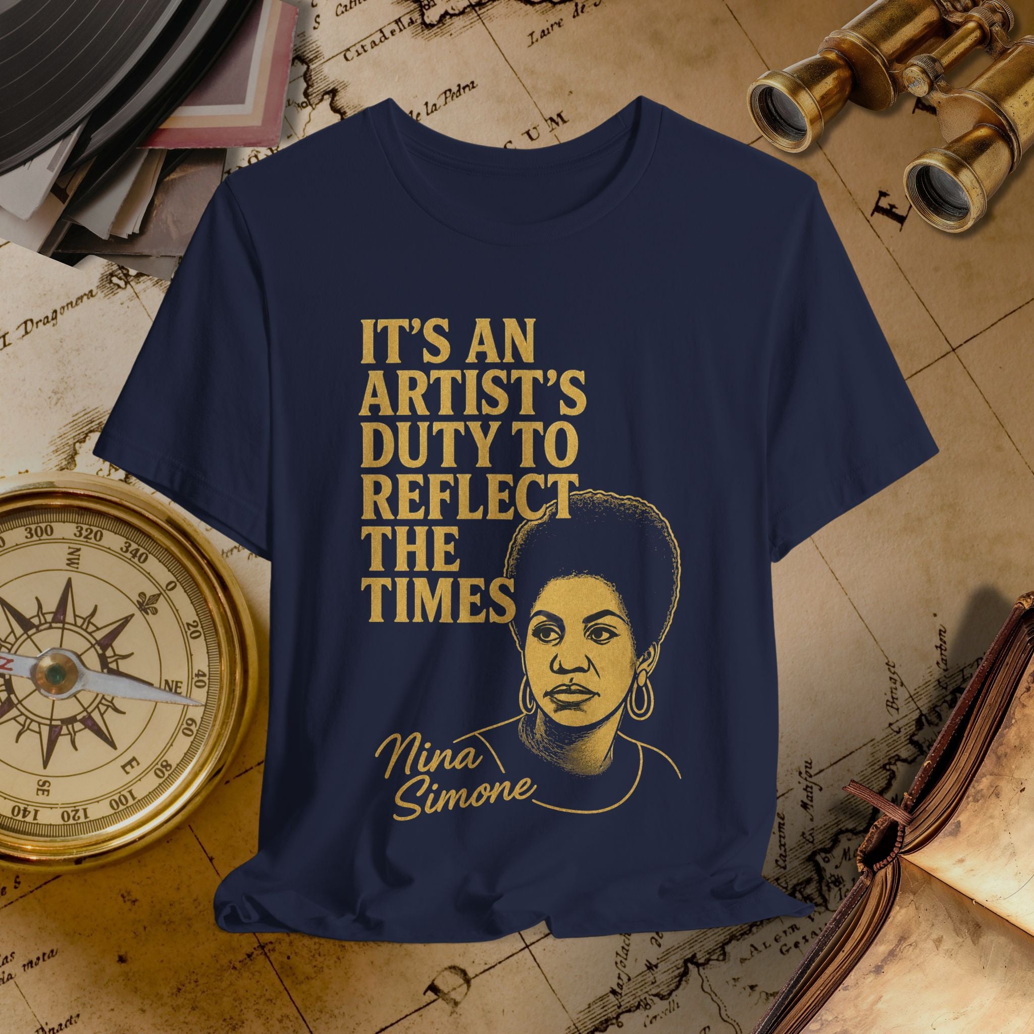 Navy blue t-shirt with gold text and a portrait of Nina Simone on a vintage map background.
