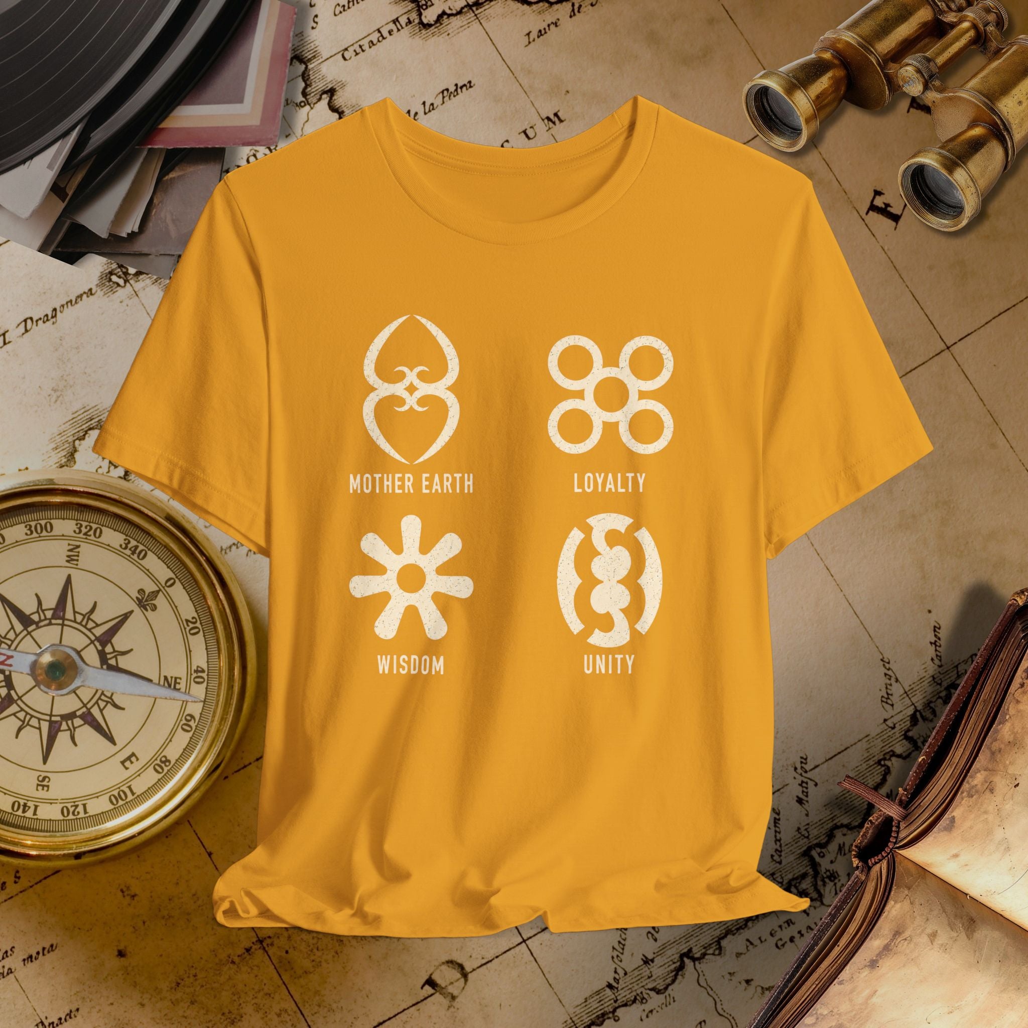 Mustard t-shirt with white symbols and text on a vintage map background