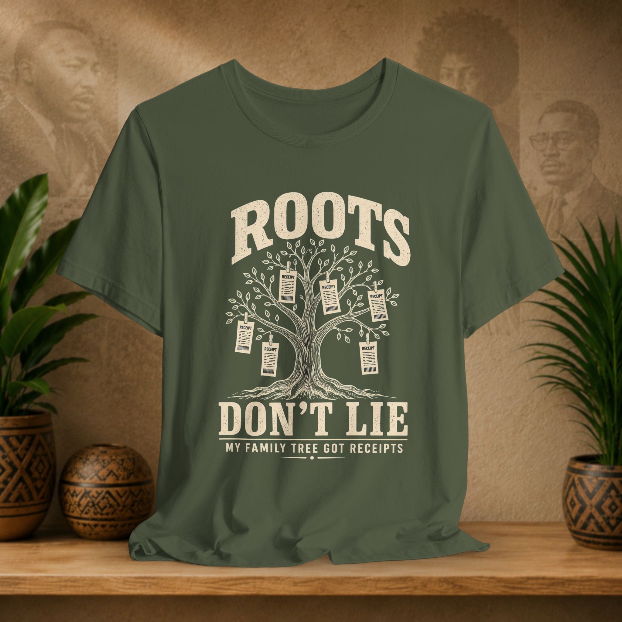 Green t-shirt with family tree design and text on a wooden surface with plants and decorative items.