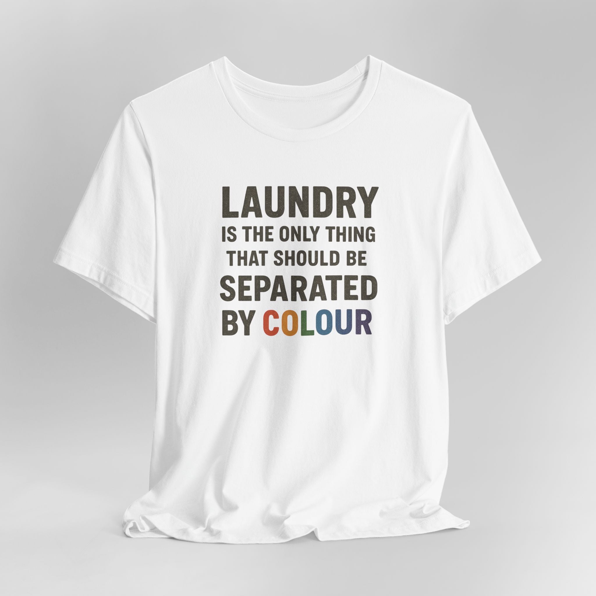 White t-shirt with humorous text design on a gray background