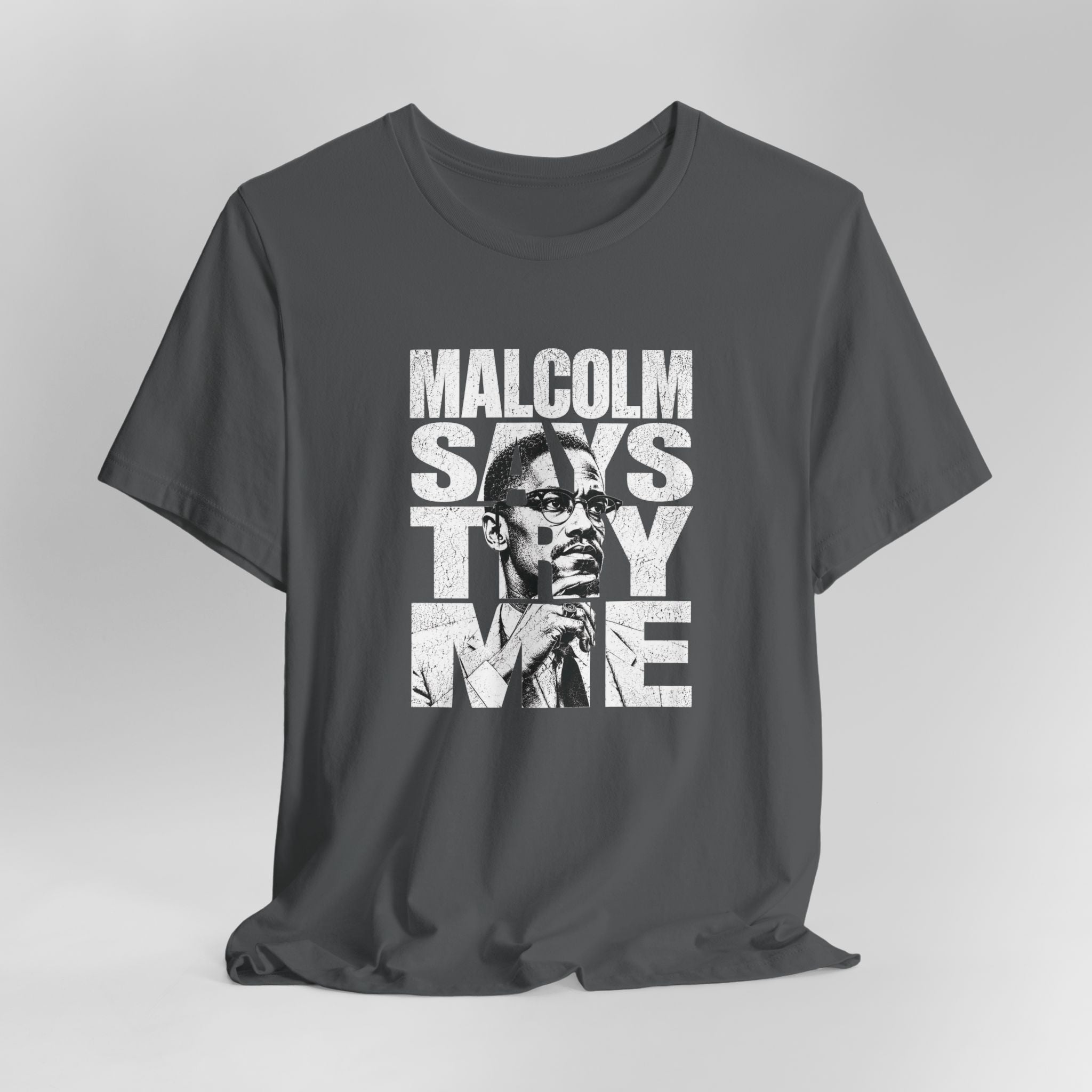 Gray t-shirt with a graphic design featuring a person and text on a gray background