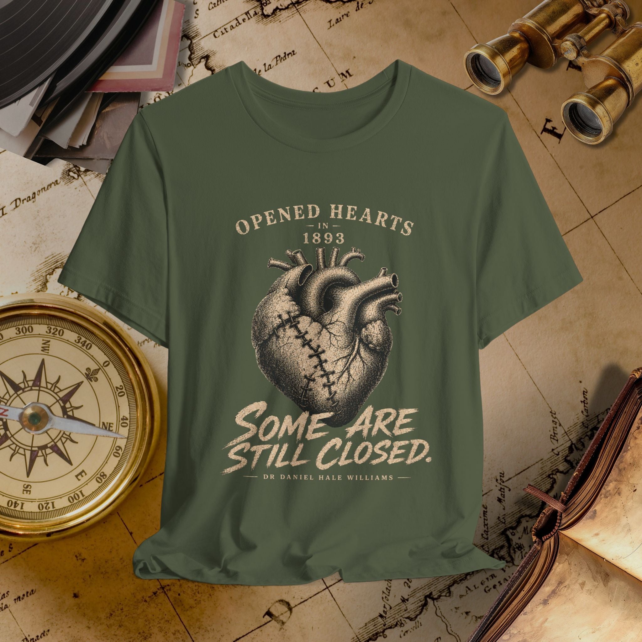 Green t-shirt with heart design and text on a vintage map background