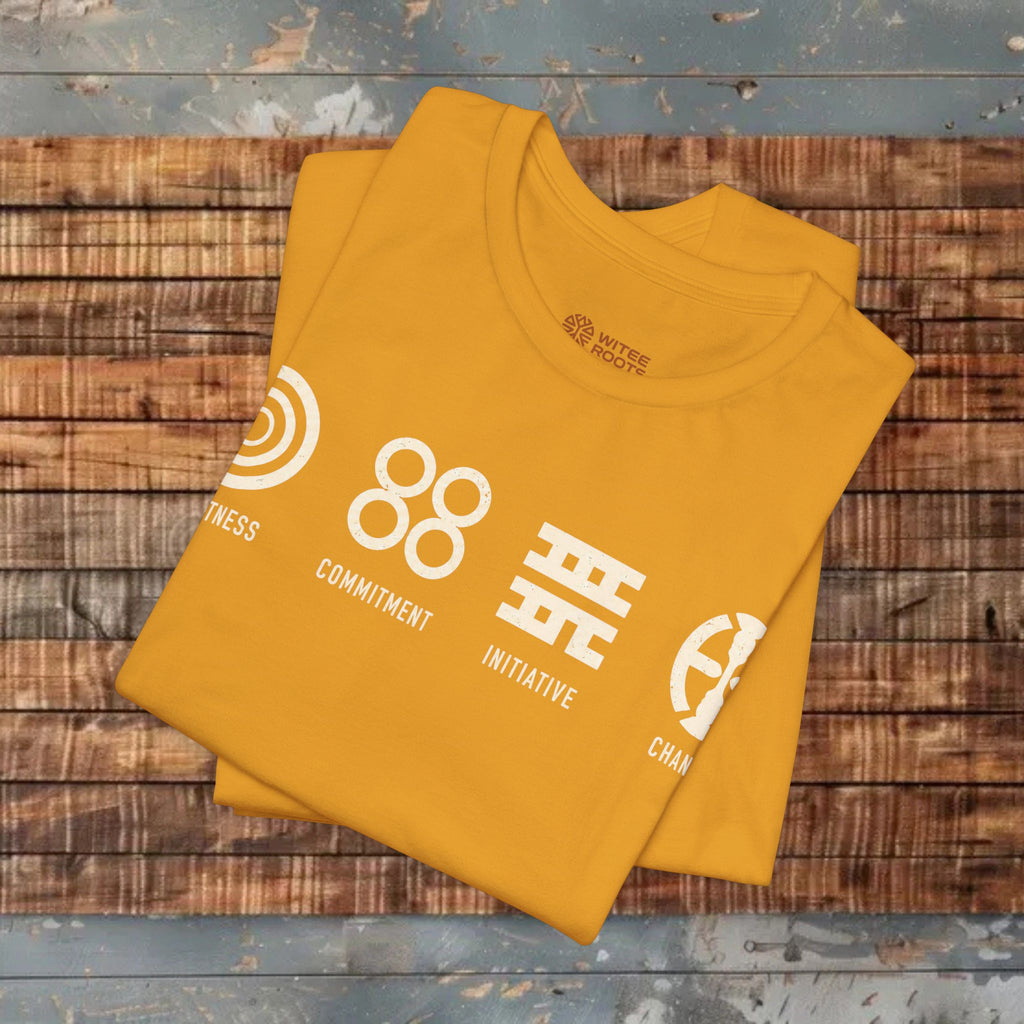 Yellow t-shirt with white graphics and text on a wooden surface