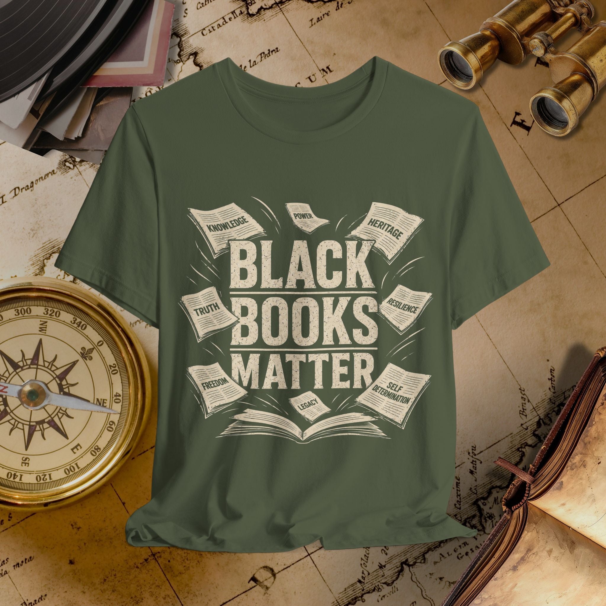 Green t-shirt with 'Black Books Matter' design on a vintage map background