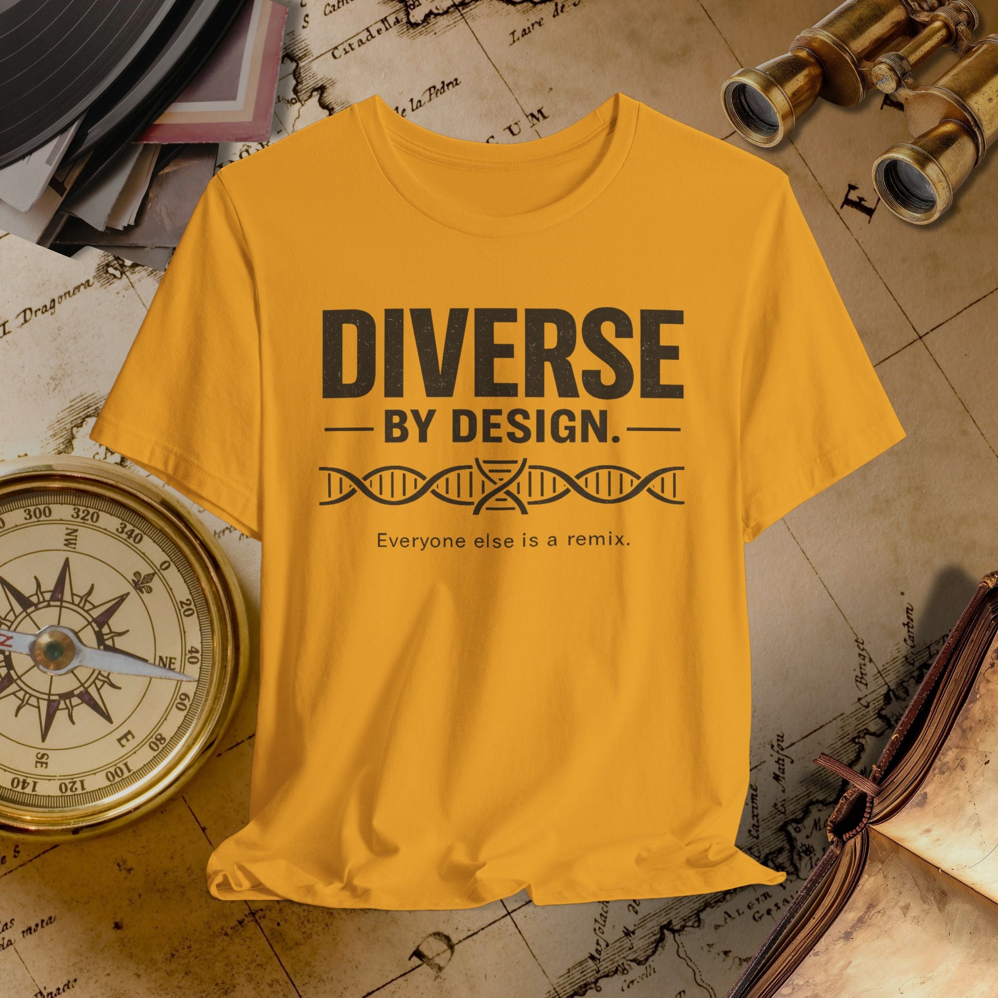 Mustard t-shirt with 'Diverse by Design' text on a vintage map background