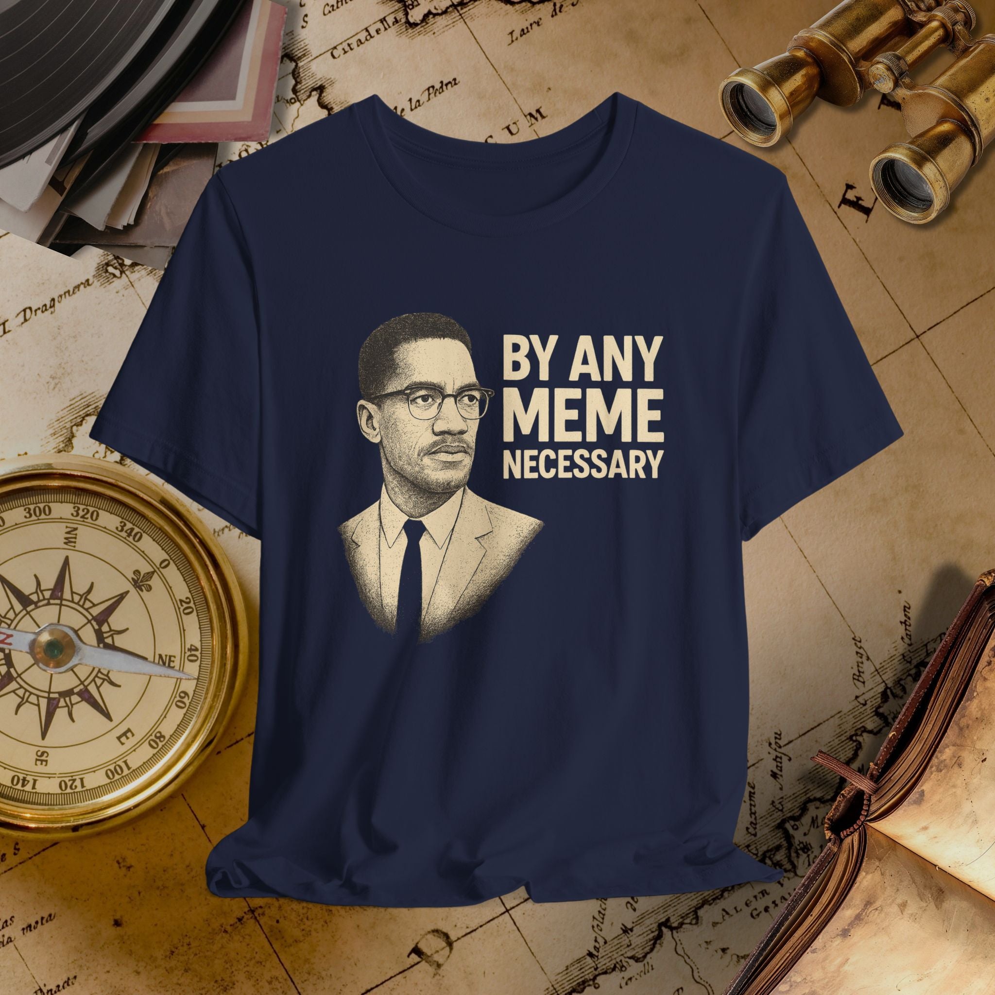 Navy blue t-shirt with a graphic of a man and text 'By Any Meme Necessary' on an old map background.
