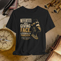Black t-shirt with gold text and graphic of a historical figure on a vintage map background.