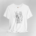 White t-shirt with black tribal face design on a gray background
