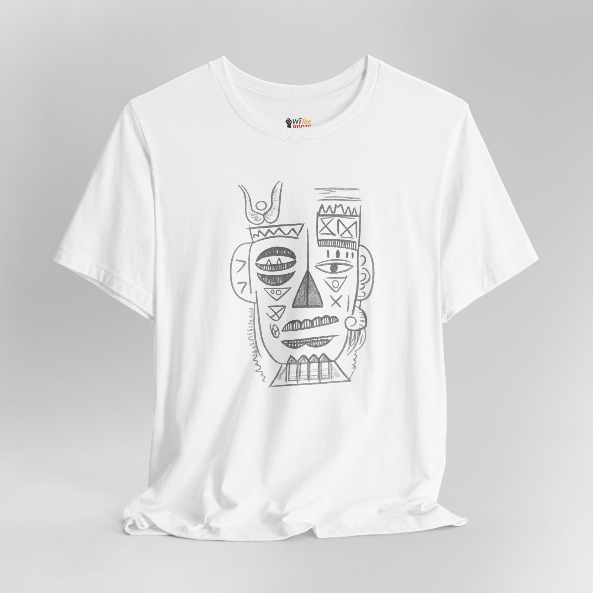 White t-shirt with black tribal face design on a gray background