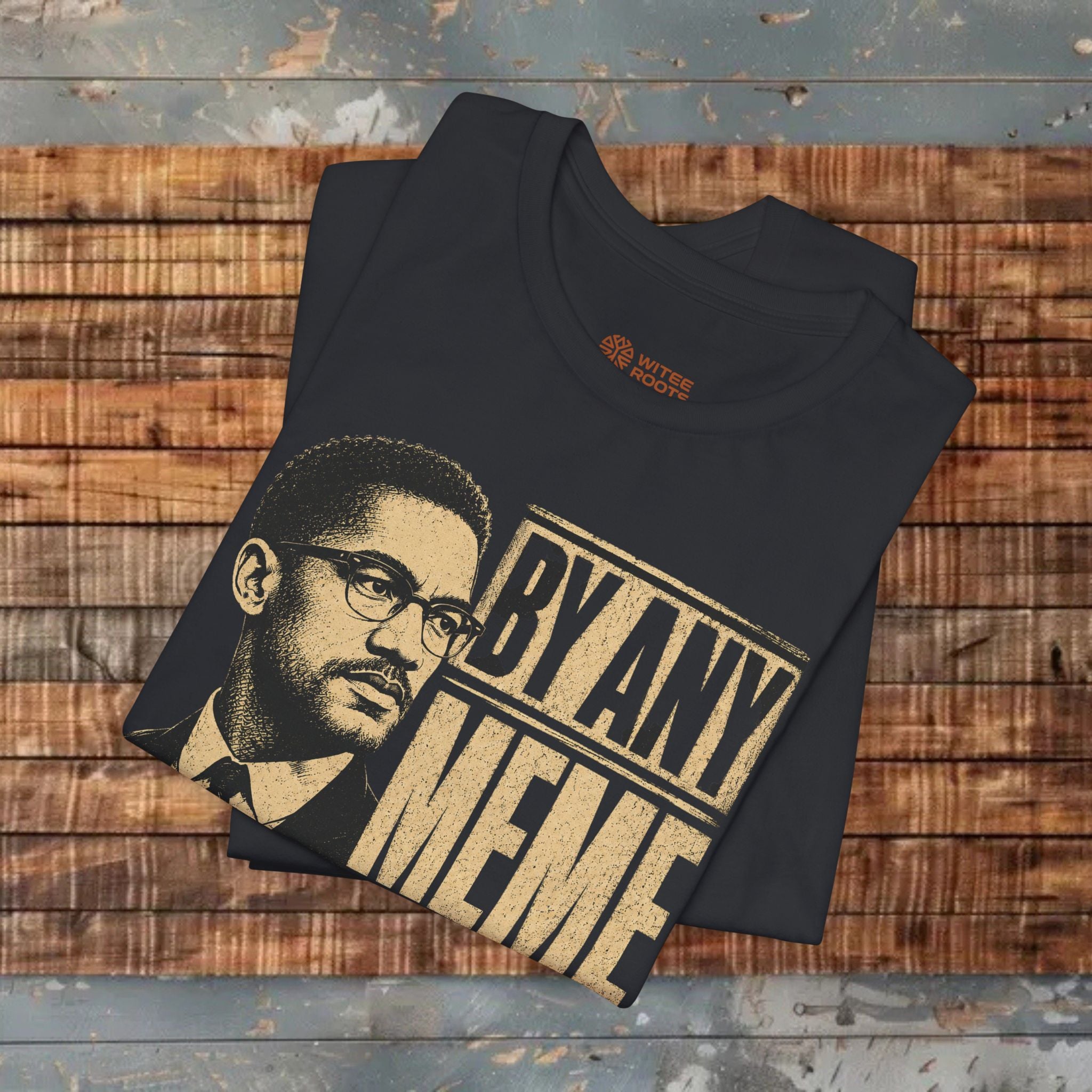 Black t-shirt with a graphic and text on a wooden surface