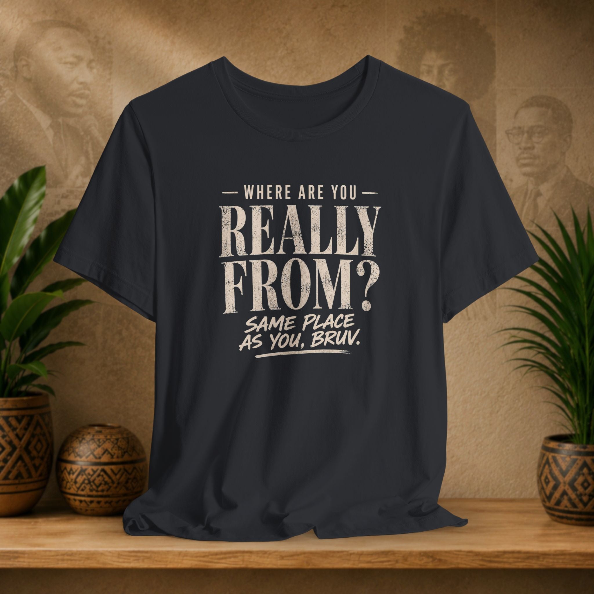 Black t-shirt with humorous text design on a wooden surface with plants and decorative items.