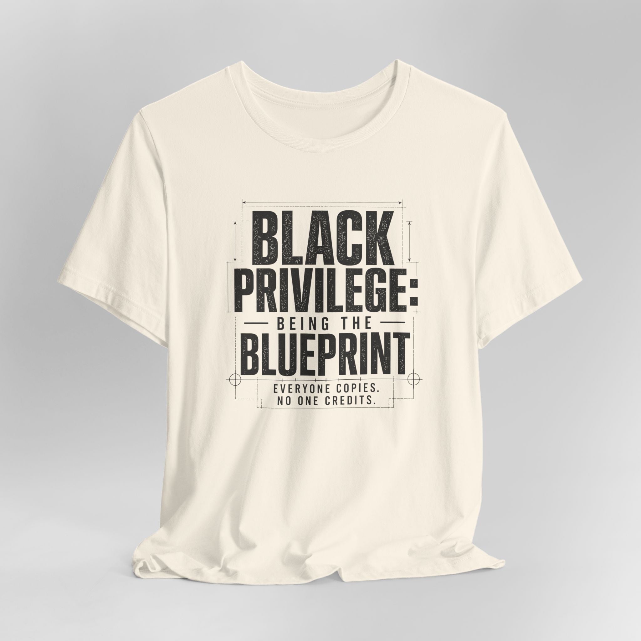 White t-shirt with black text on a gray background