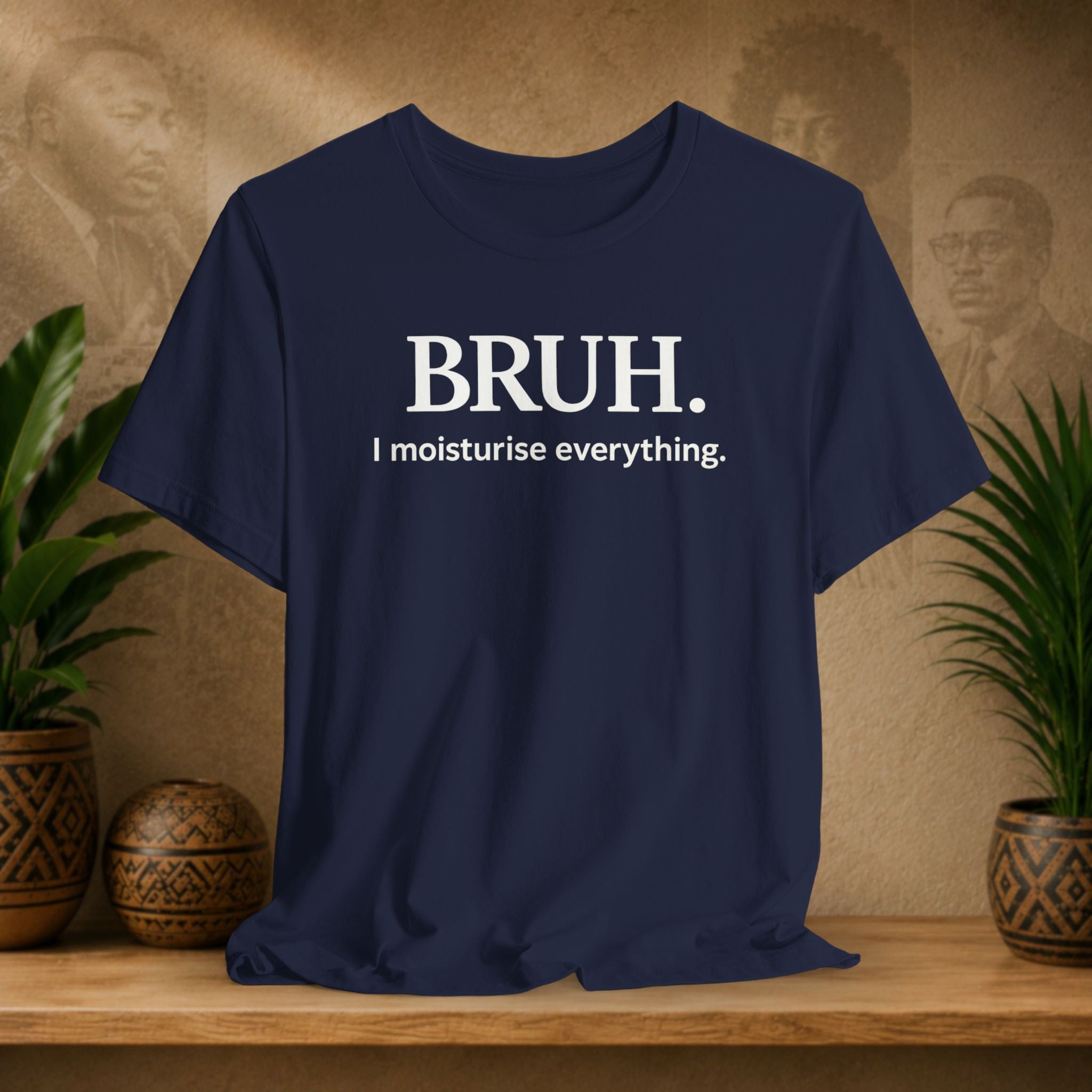 A navy blue short-sleeve t-shirt with white printed text reading 'BRUH. I moisturise everything.