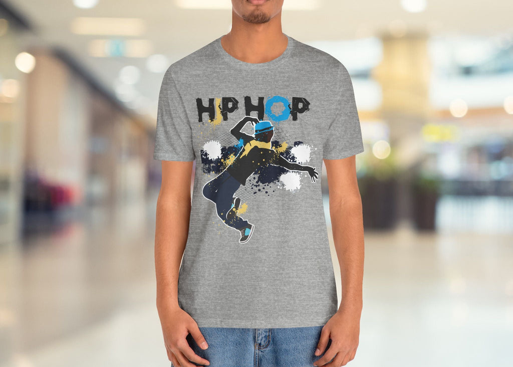 Person wearing a gray t-shirt with a graphic design and text in a mall setting