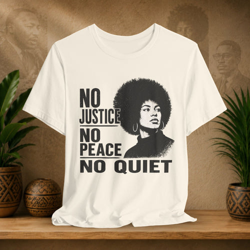 Beige Tshirt with graphic and text on a wooden surface with plants and a textured wall background