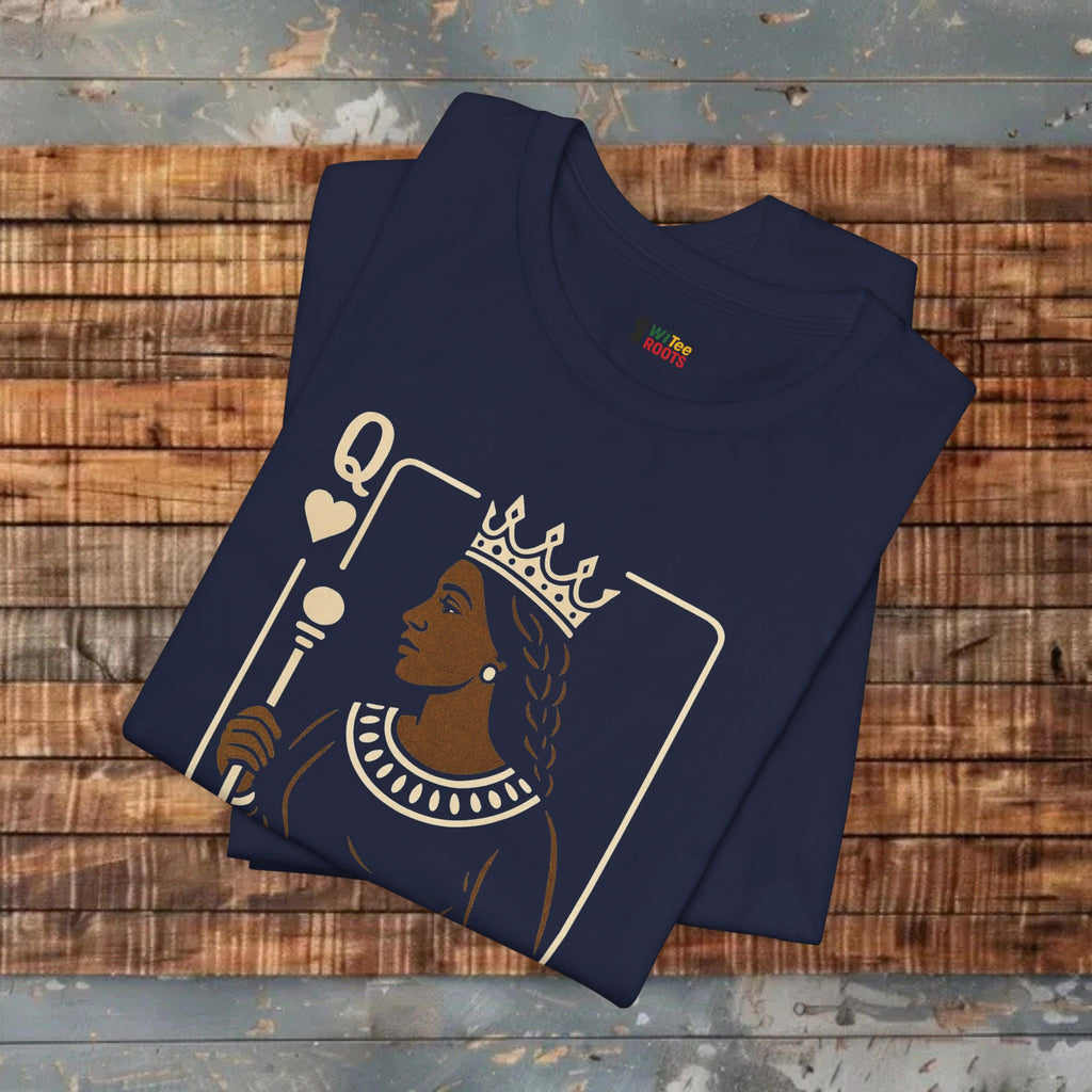 Folded navy t-shirt with a graphic design on a wooden surface