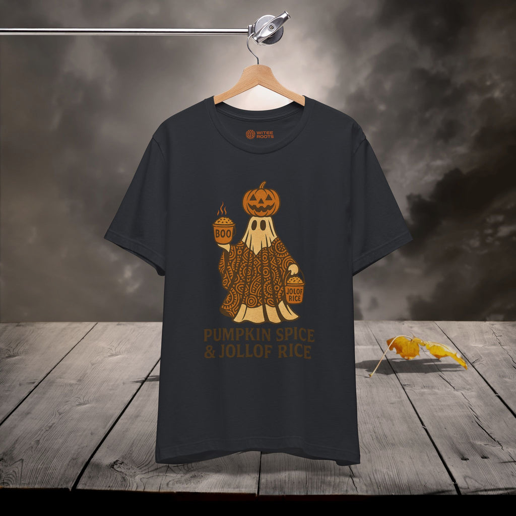 Black t-shirt with pumpkin spice and jollof rice graphic on a wooden surface with dark background