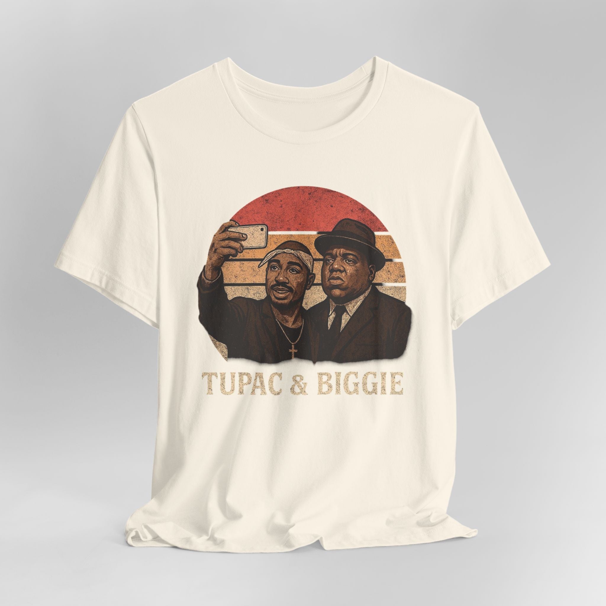  Beige t-shirt with graphic of two men and 'Tupac & Biggie' text on a gray background