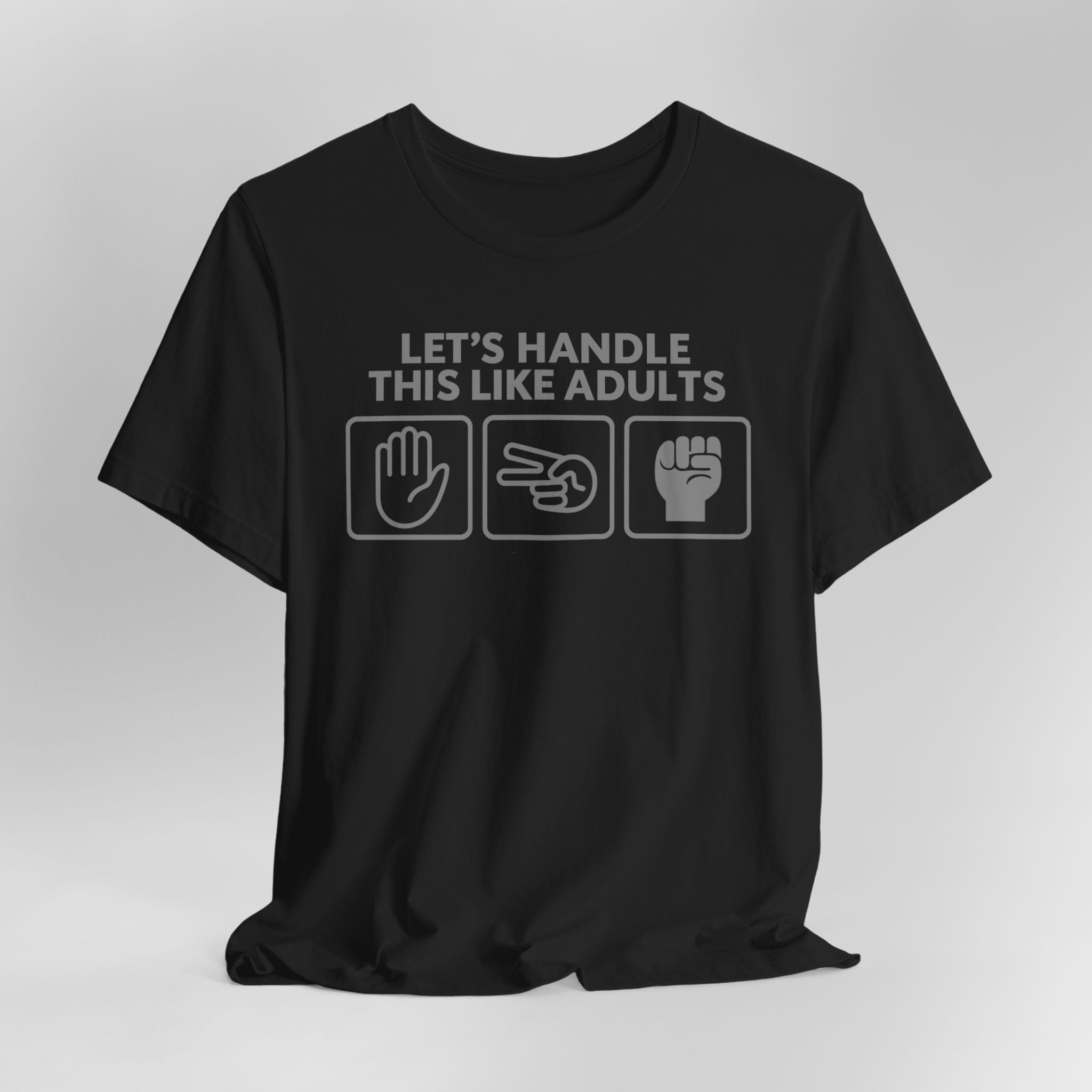 Black t-shirt with text and icons on a gray background