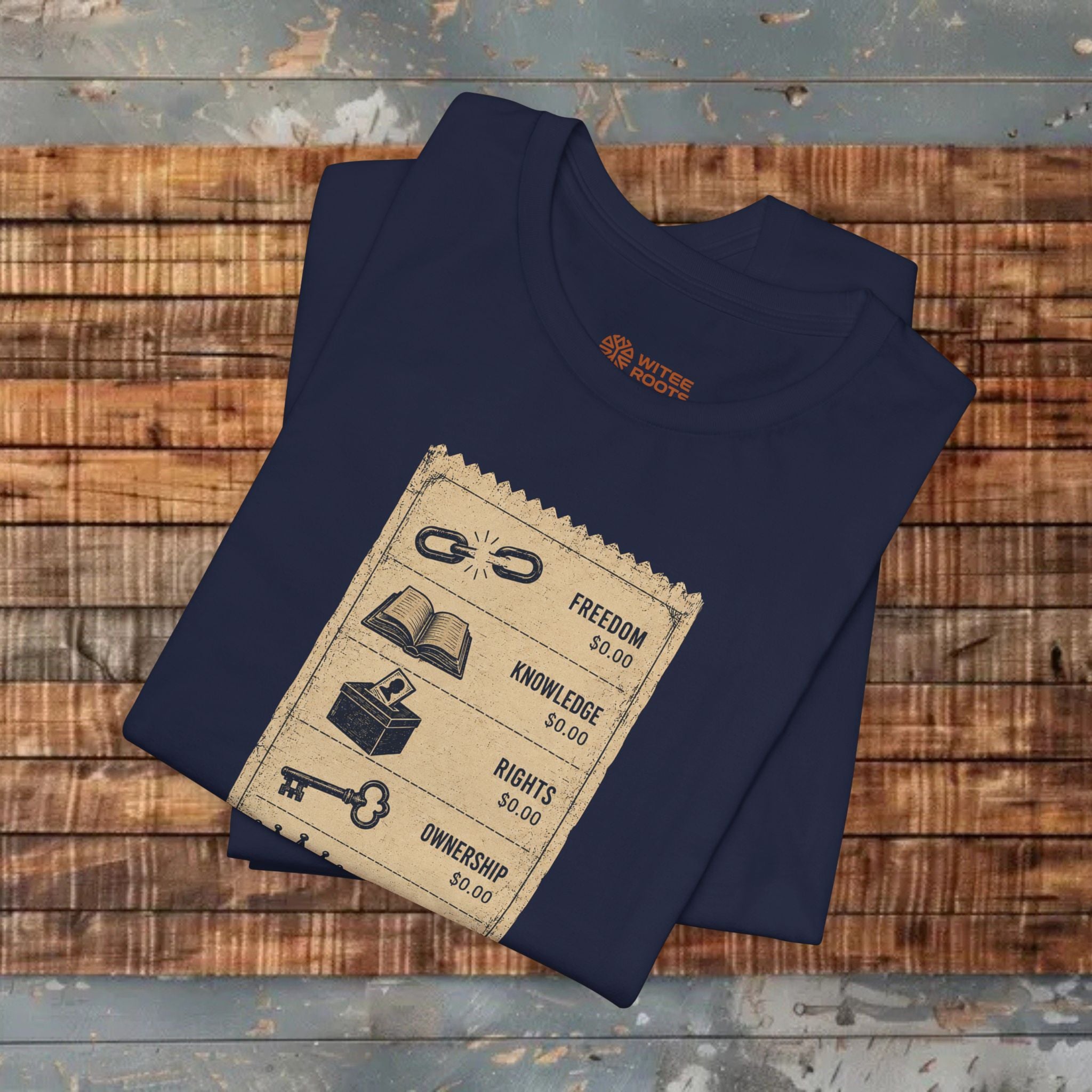 Folded navy blue t-shirt with a graphic design on a wooden surface