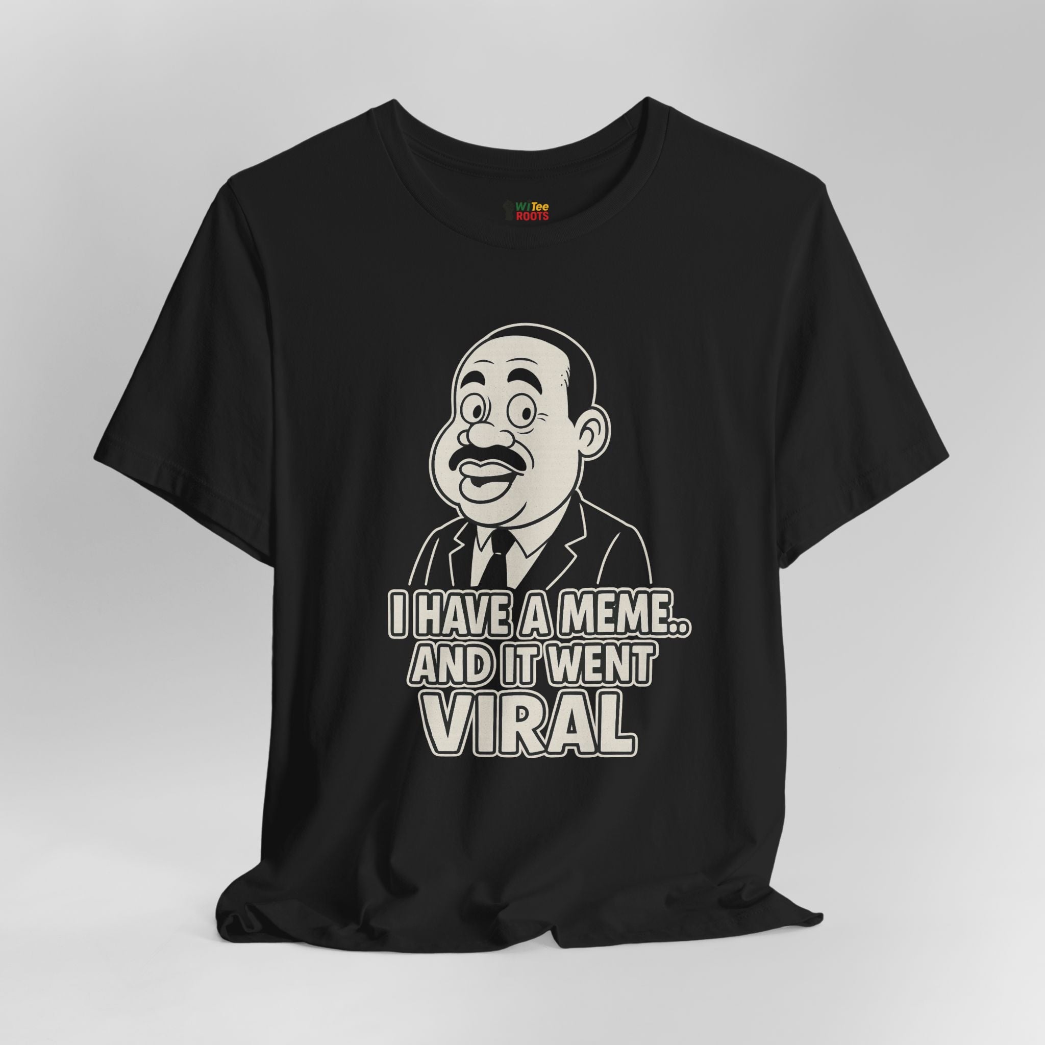 Black t-shirt with a graphic of a man and text 'I have a meme... and it went viral' on a gray background