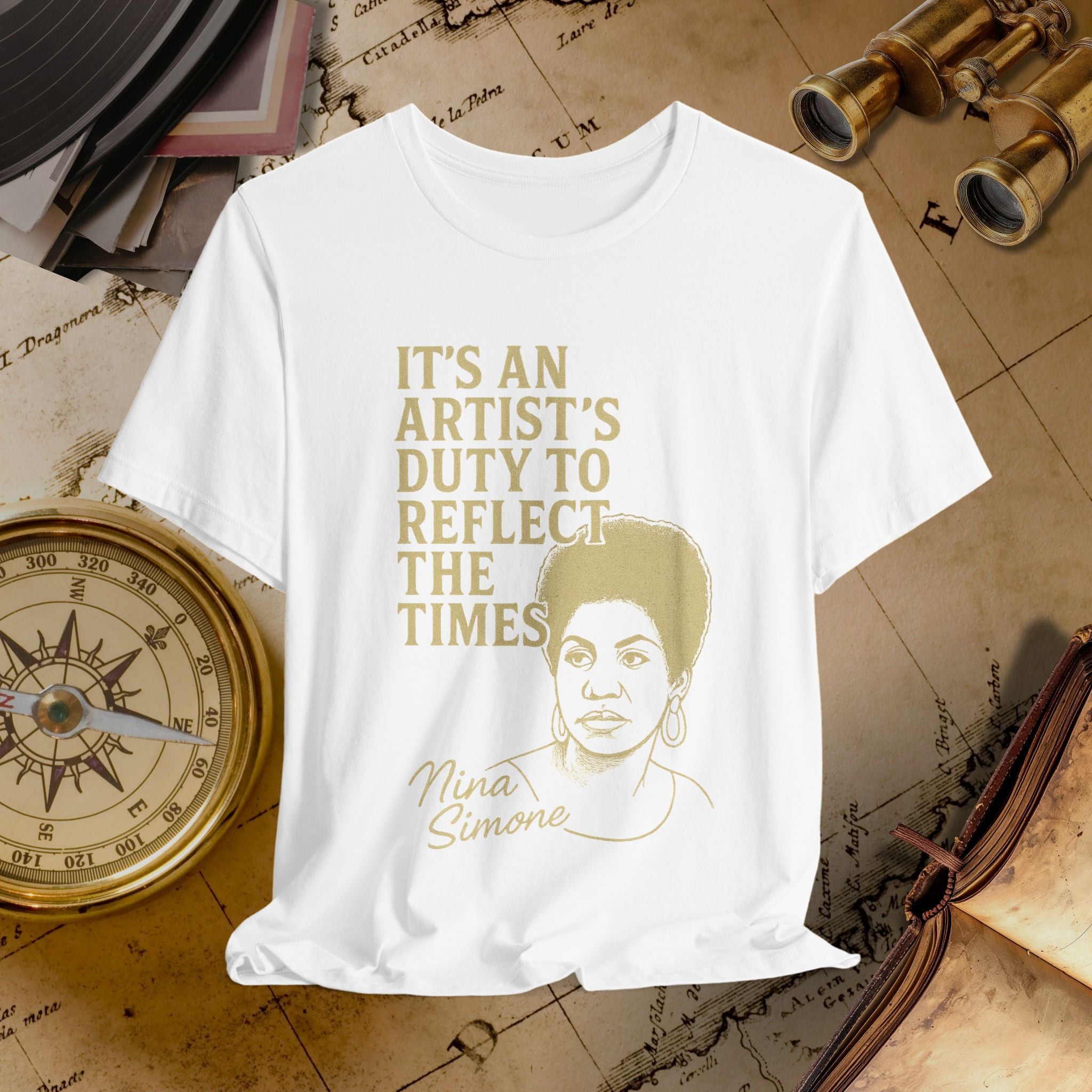 White t-shirt with gold text and portrait on a vintage background