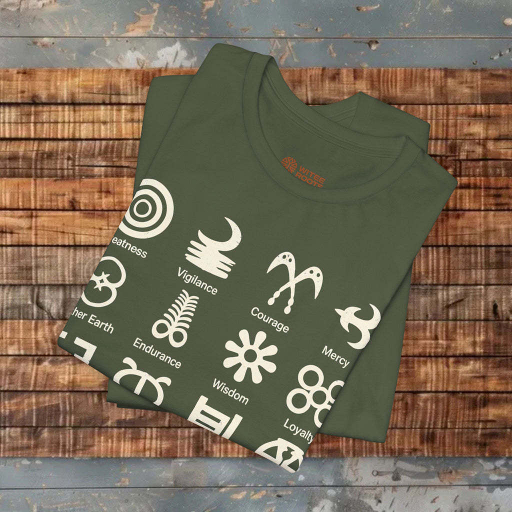 Green t-shirt with white symbols and text on a wooden surface