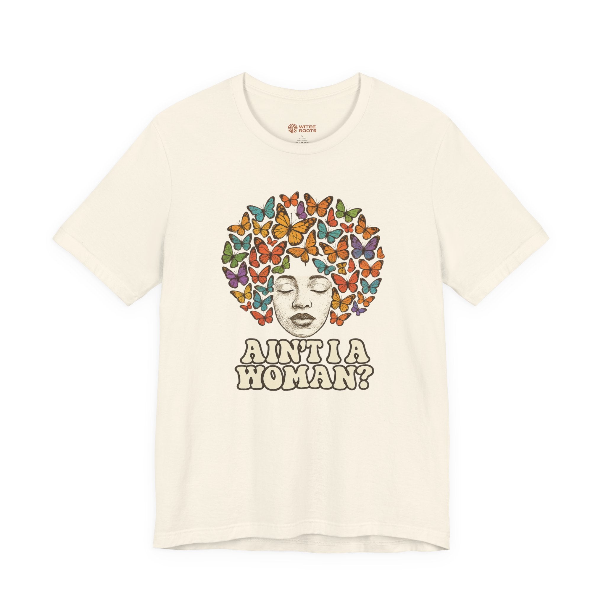 An off-white short-sleeve t-shirt with a graphic print of a face surrounded by colorful butterflies, with the text 'AINT A WOMAN?' below it.