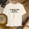 Beige t-shirt with text 'NO, YOU CAN'T TOUCH MY HAIR. I SAID WHAT I SAID.' on a vintage map background.