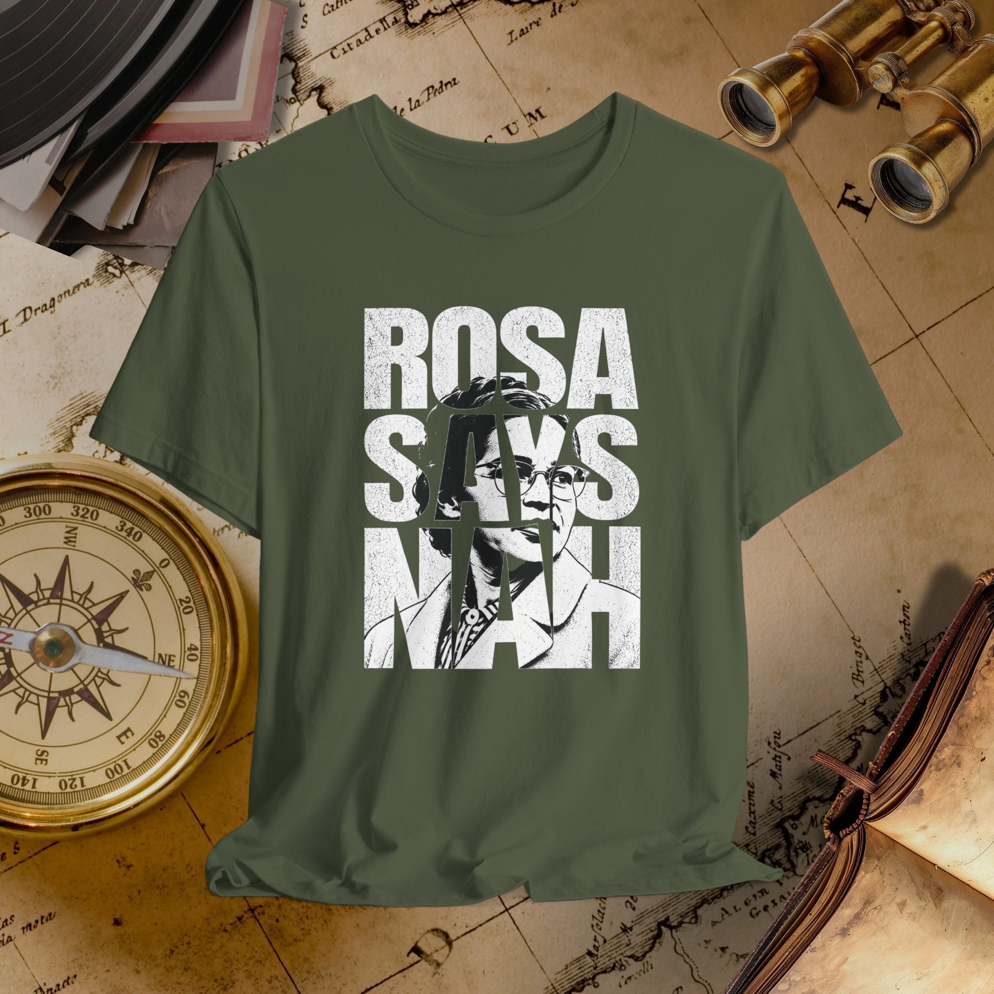 Green t-shirt with 'ROSA SAYS NAAH' graphic on a vintage map background