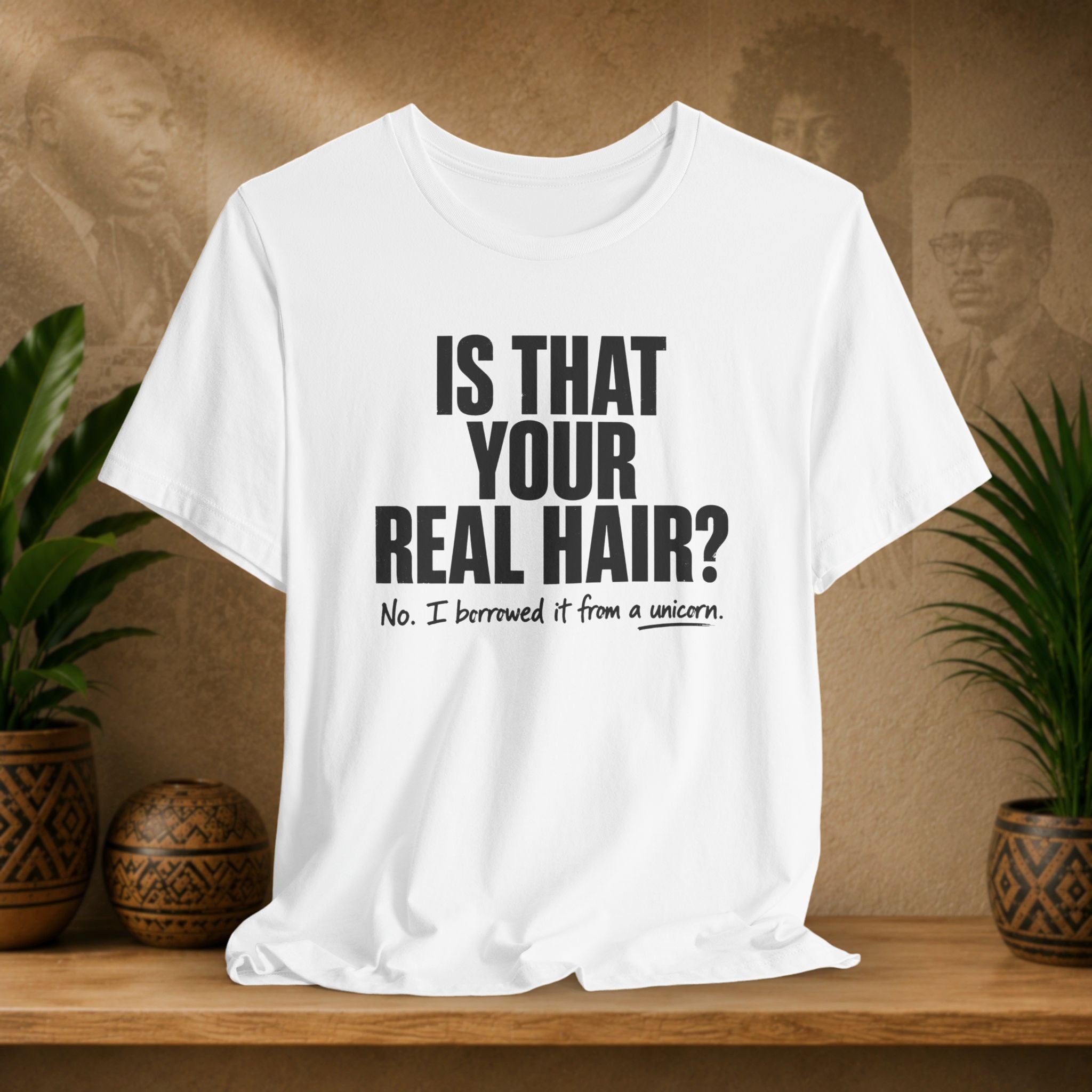 White t-shirt with humorous text on a wooden shelf with plants and a textured wall background