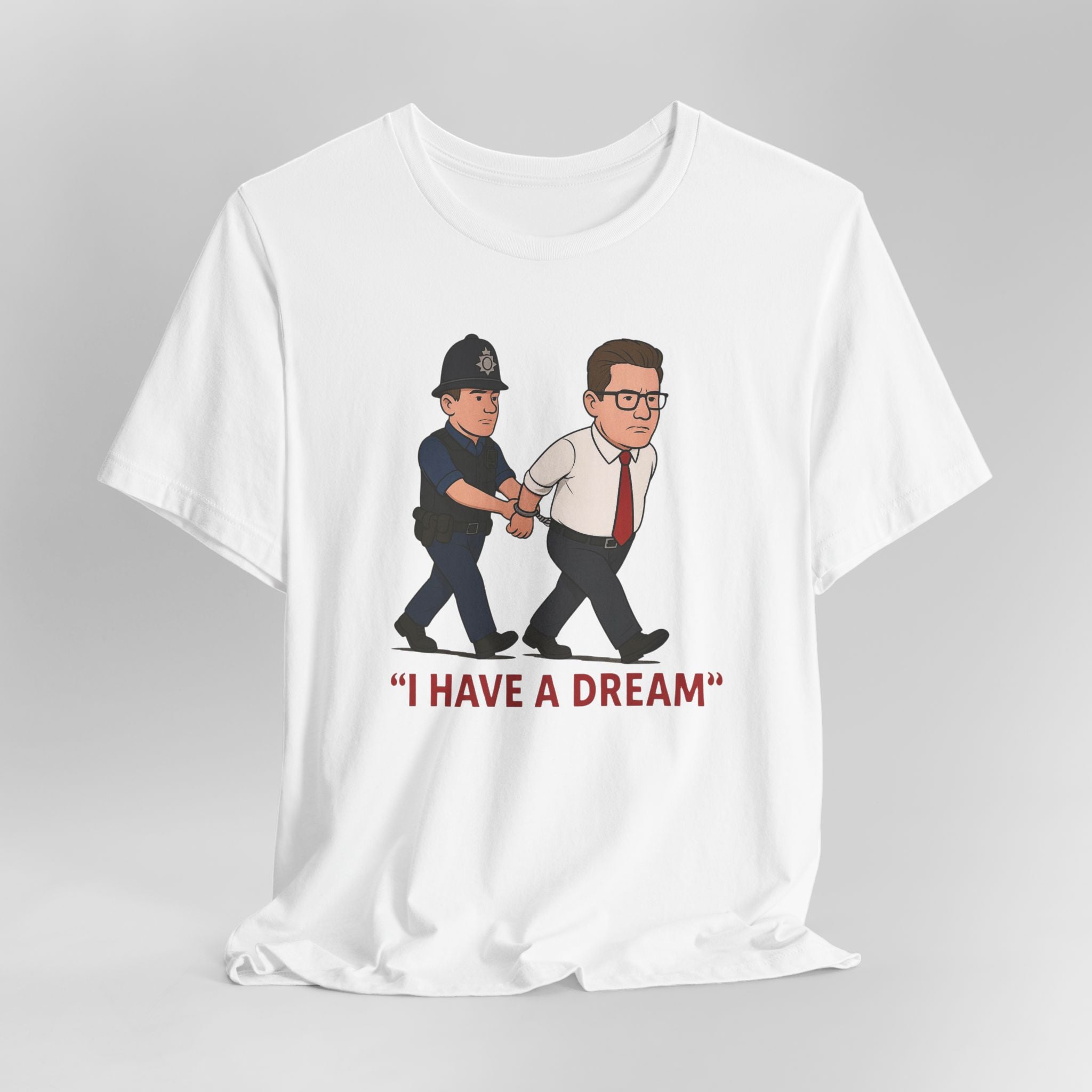 White t-shirt with graphic of a police officer and a man being arrested, with 'I HAVE A DREAM' text.