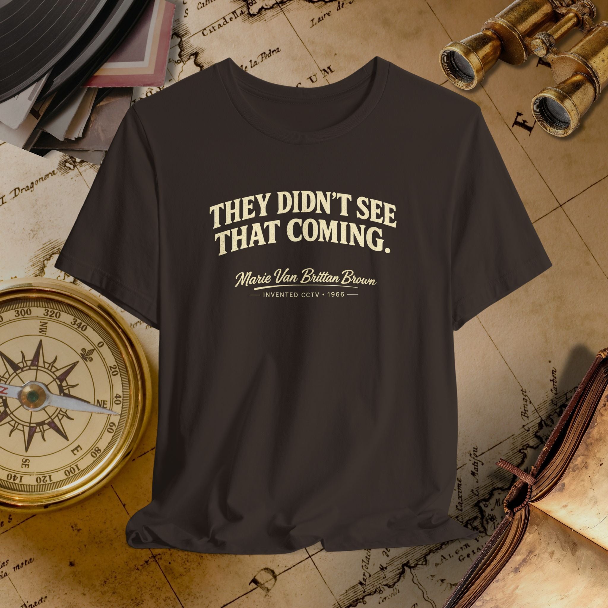 Brown t-shirt with text on a vintage map background