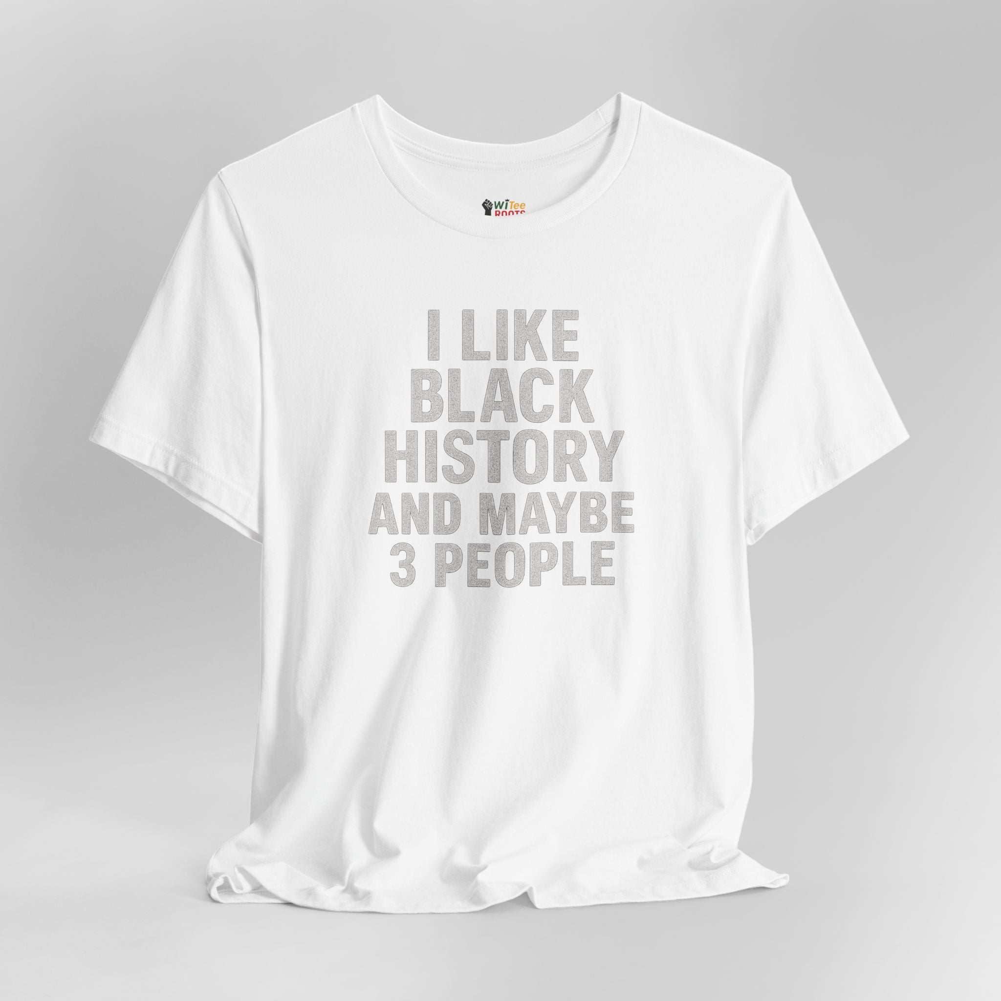 White t-shirt with text 'I LIKE BLACK HISTORY AND MAYBE 3 PEOPLE' on a gray background