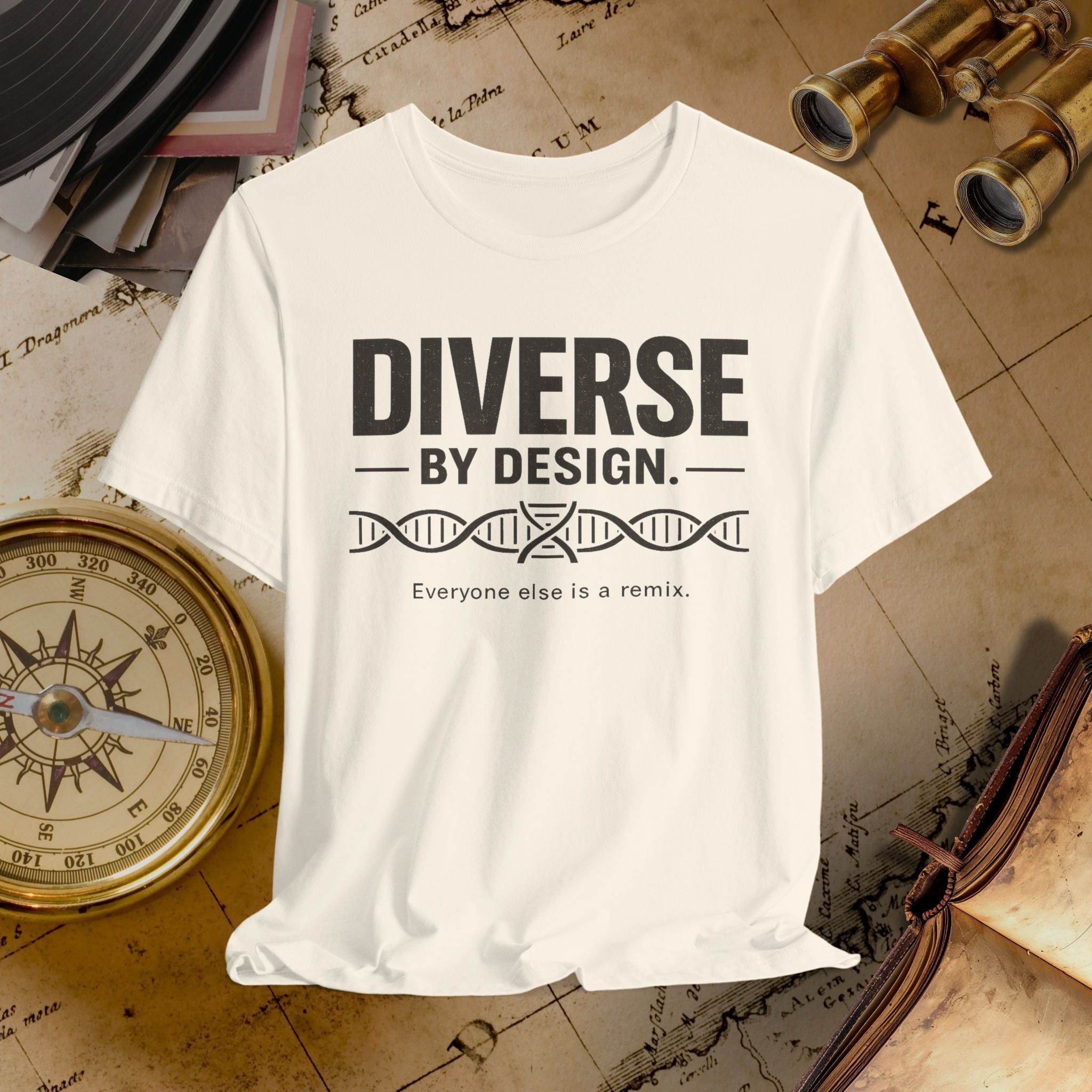 Beige t-shirt with 'Diverse by Design' text on a vintage map background