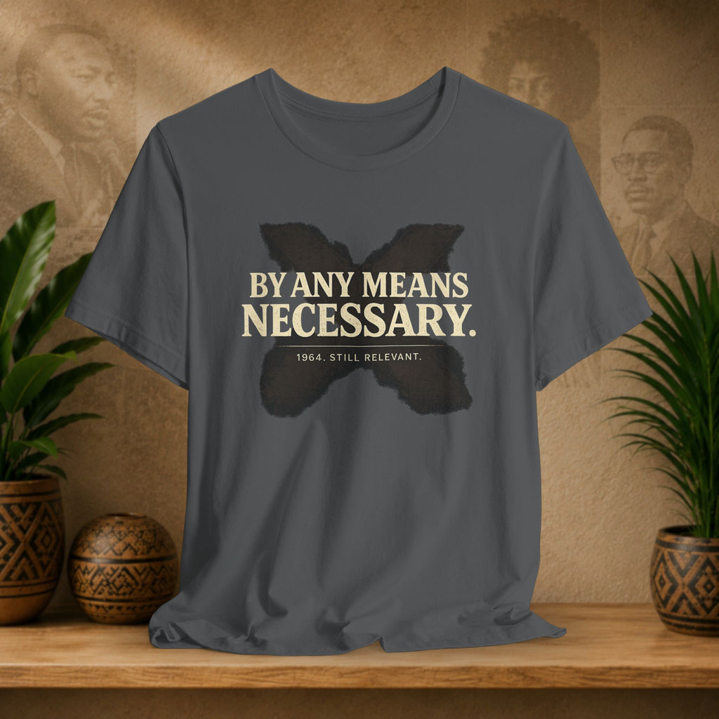 Gray t-shirt with a butterfly graphic and text on a wooden surface with decorative items.