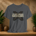 Gray t-shirt with a butterfly graphic and text on a wooden surface with decorative items.