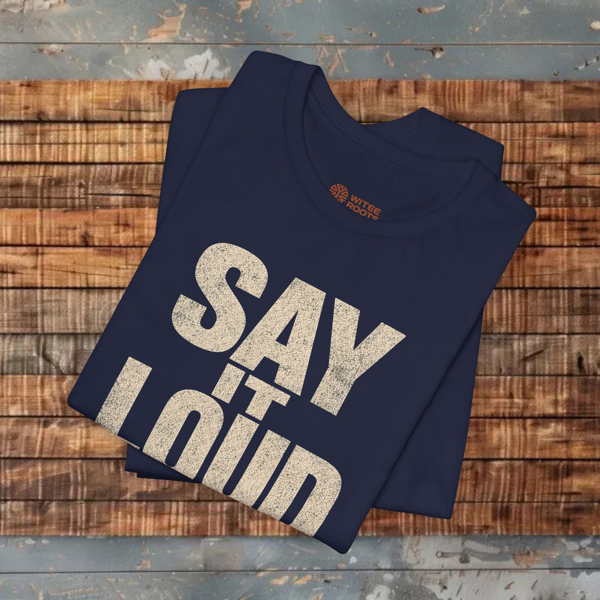 Folded navy  tshrts on a wooden surface