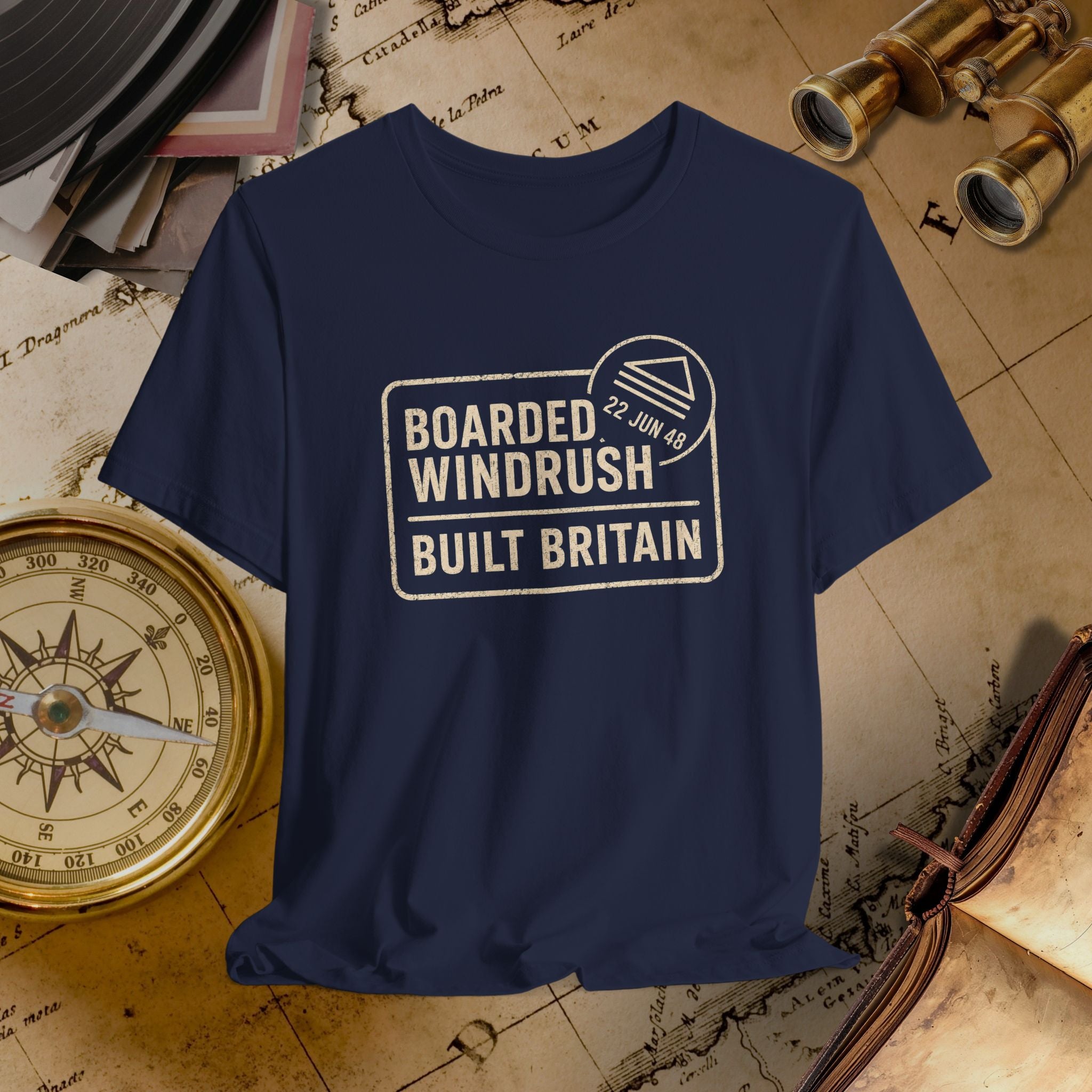Navy t-shirt with 'Boarded Windrush Built Britain' text on a vintage map background