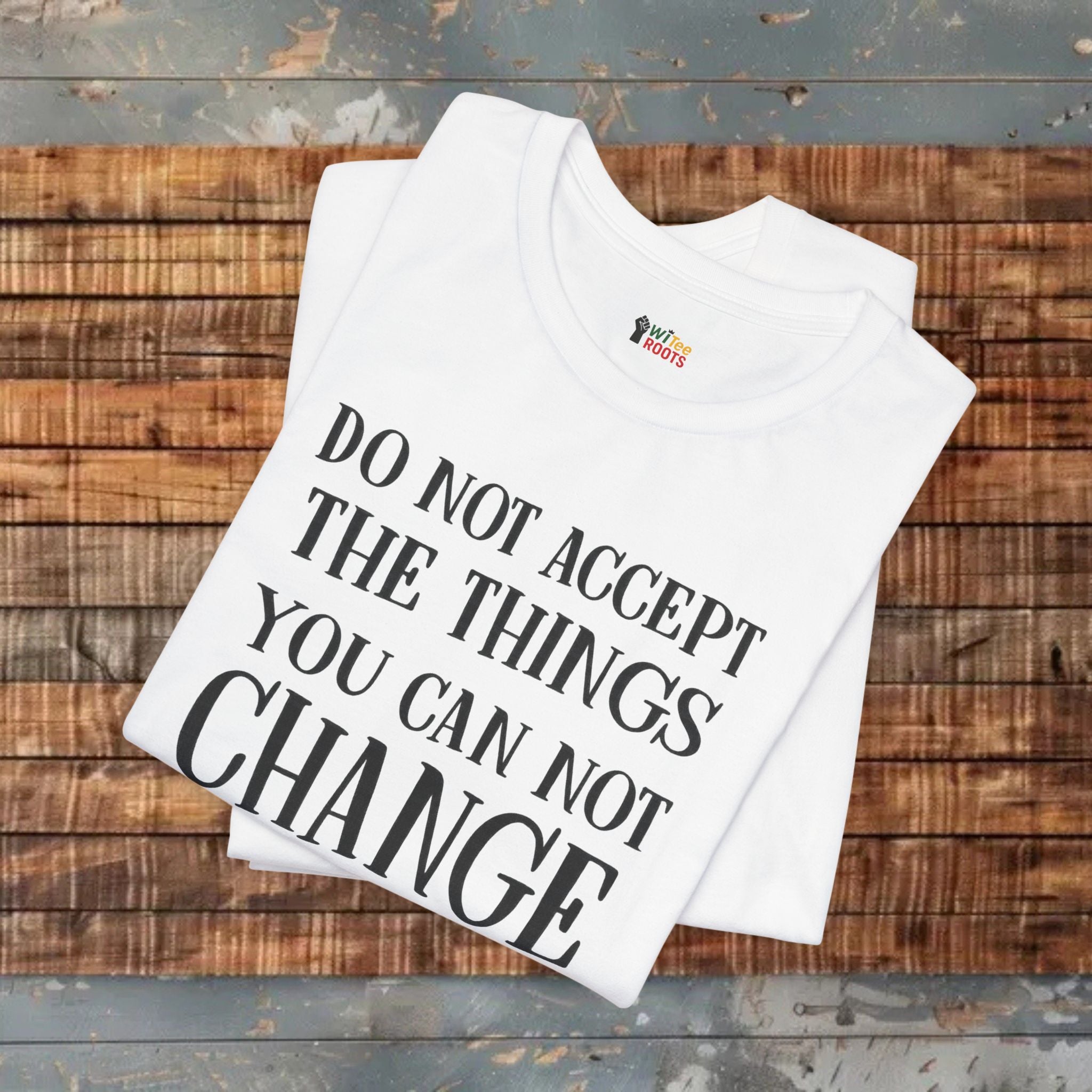 White t-shirt with motivational quote on a wooden surface