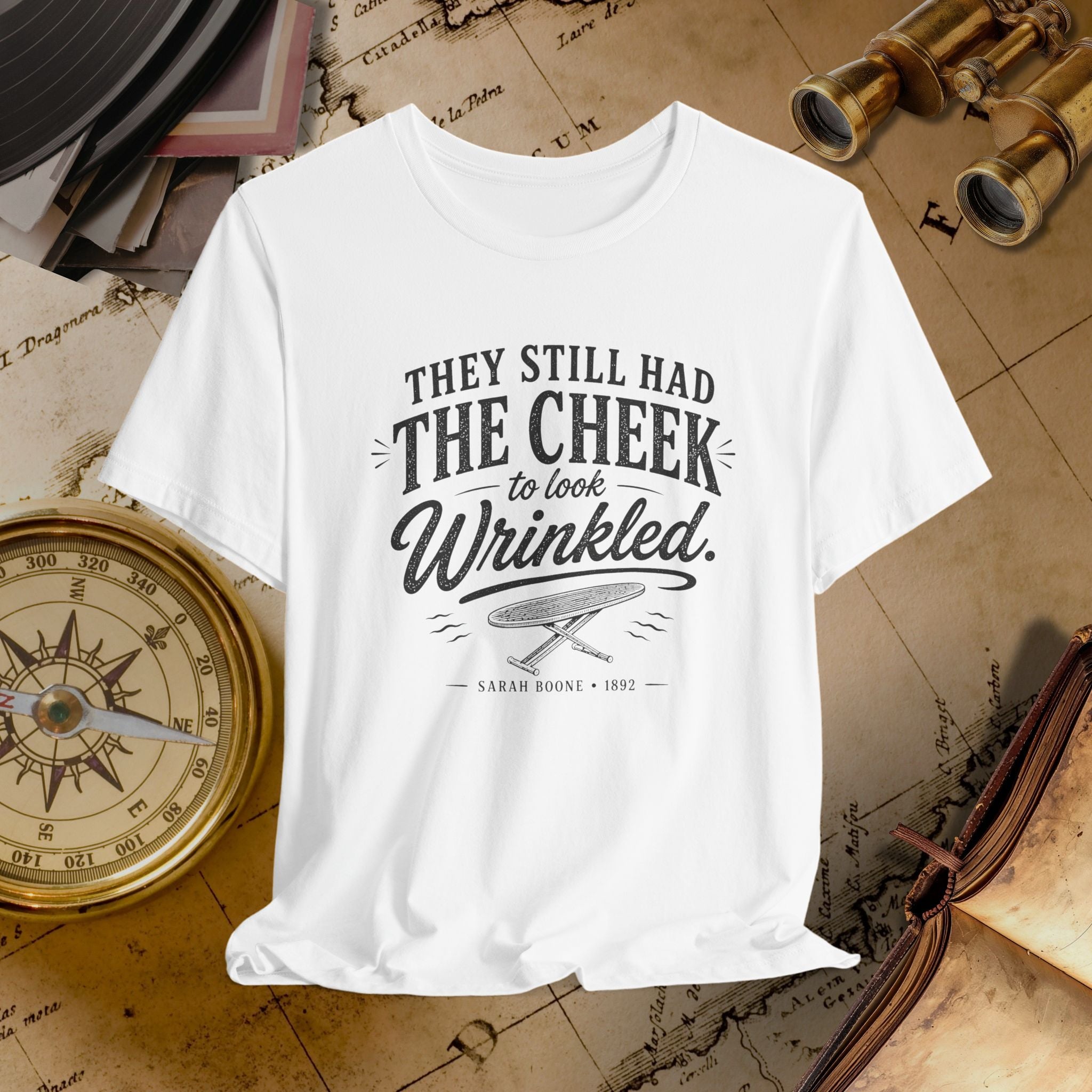 White t-shirt with vintage-style text on a historical-themed background